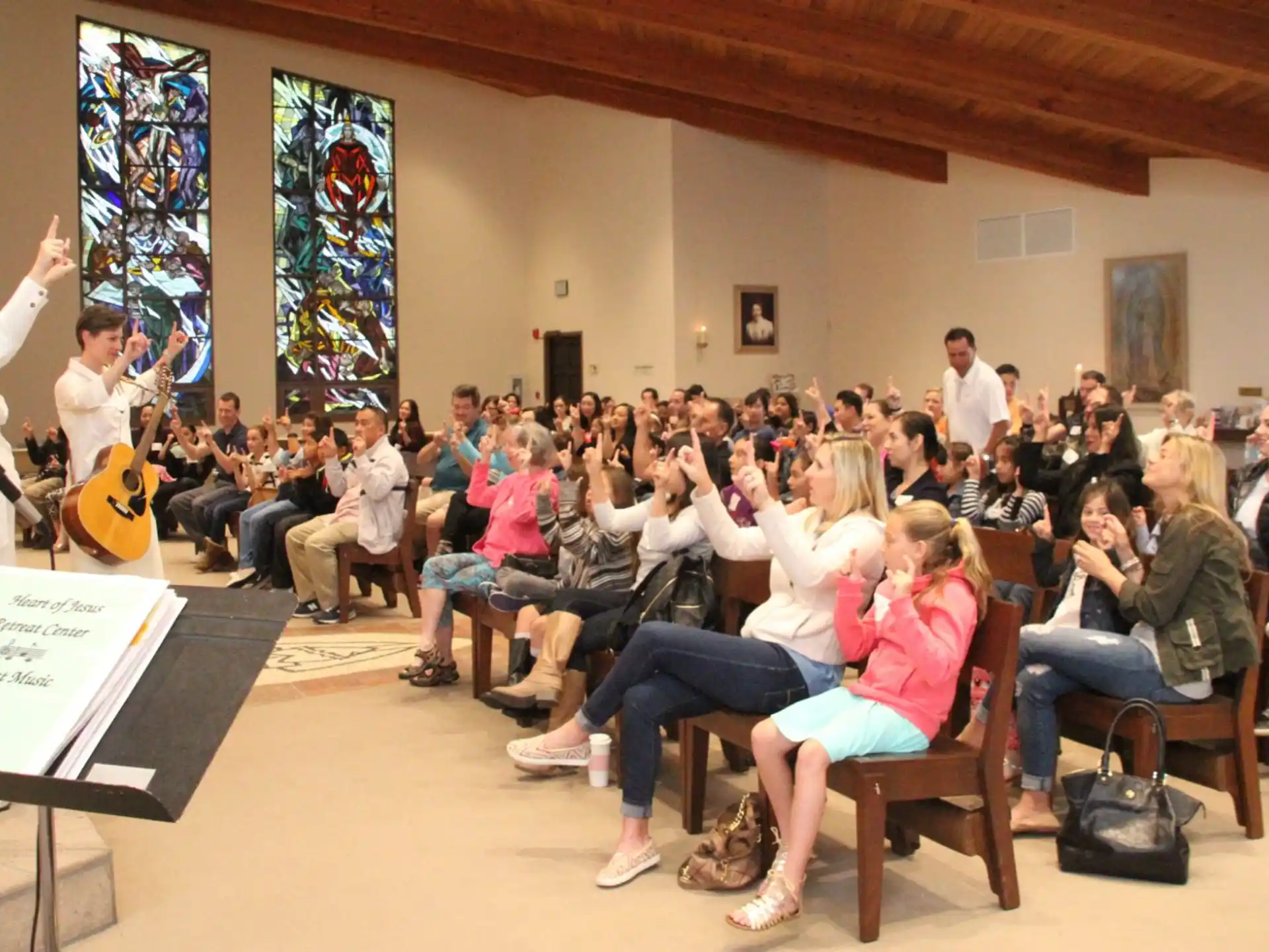 a group of people sitting in a room with instruments