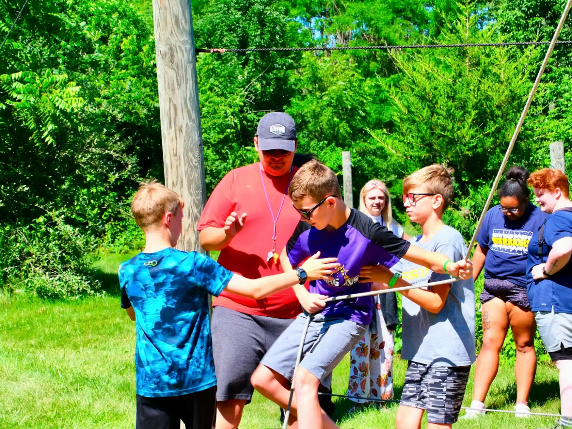 a group of people holding a rope