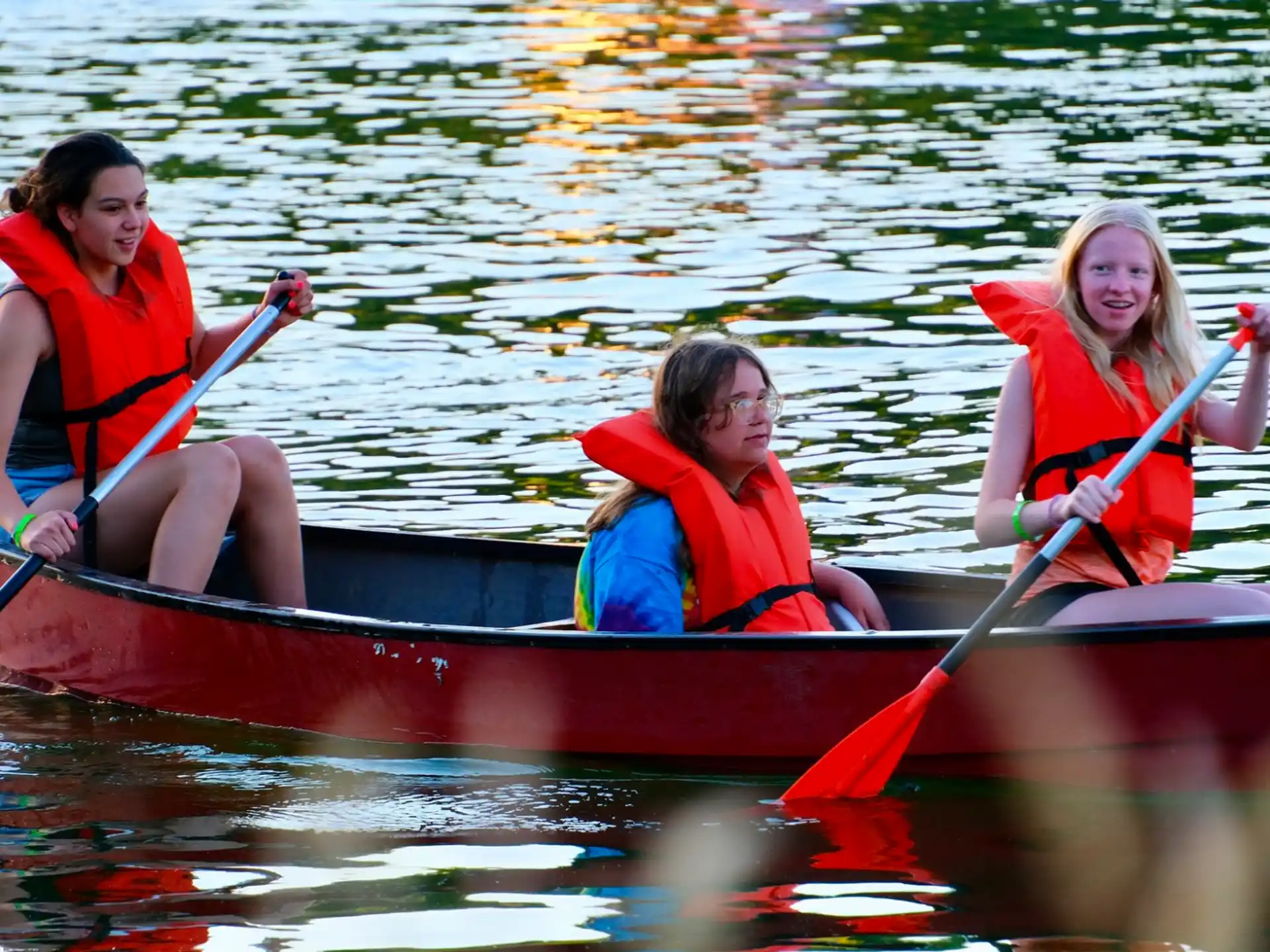 a group of people in a canoe