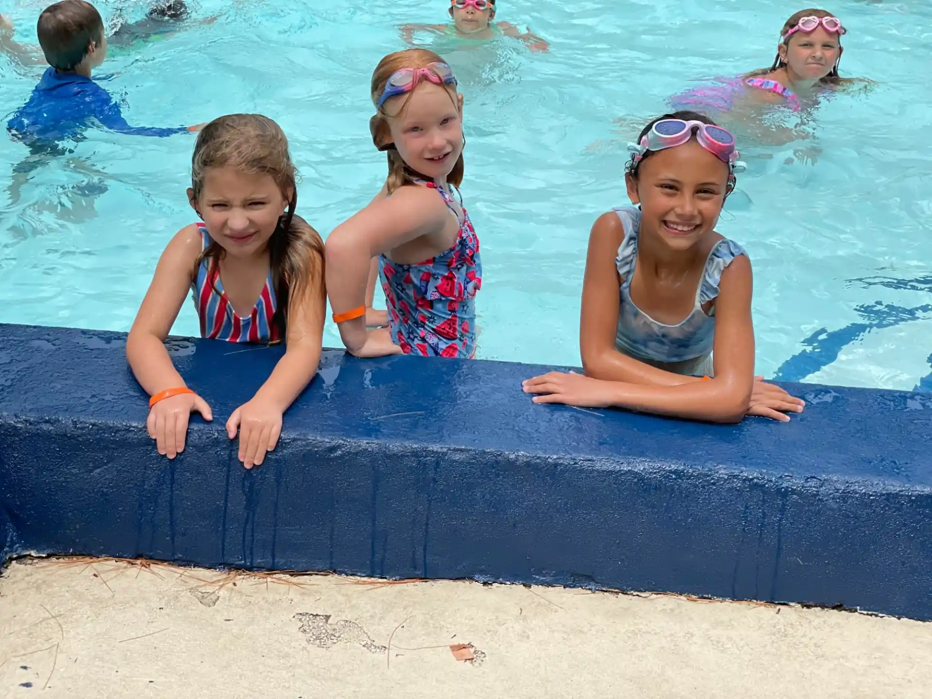 a group of girls in a pool