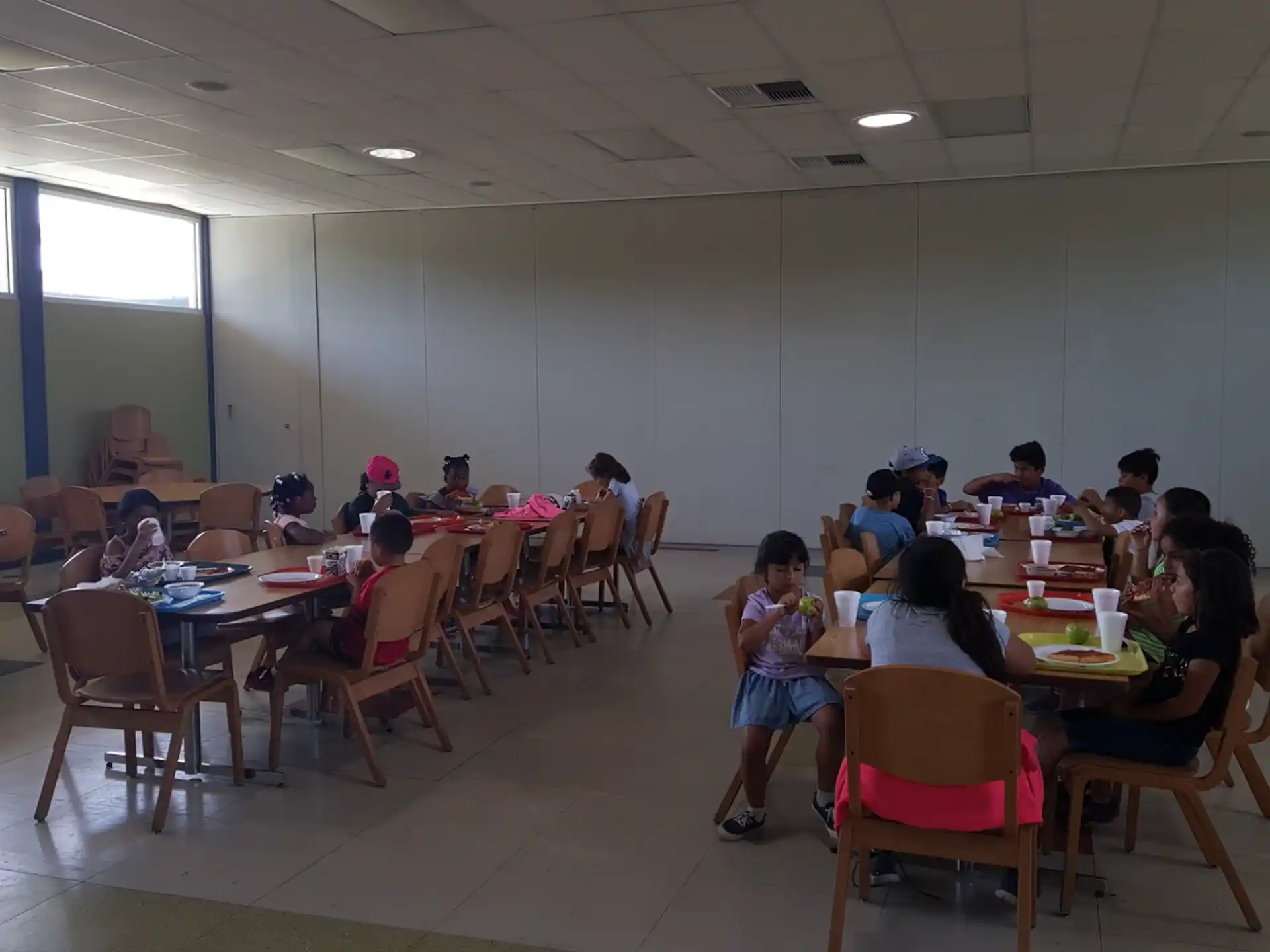 a group of people sitting at tables