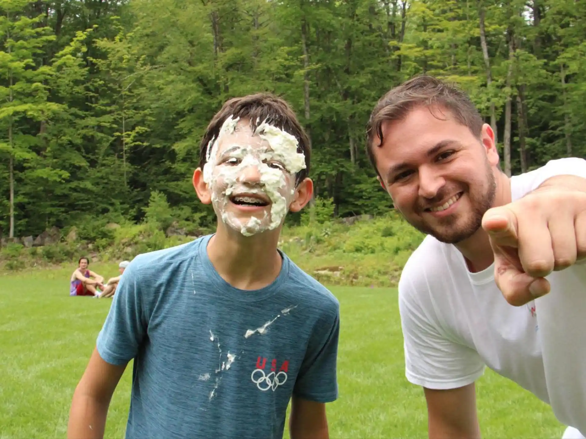 two men with a substance on their face