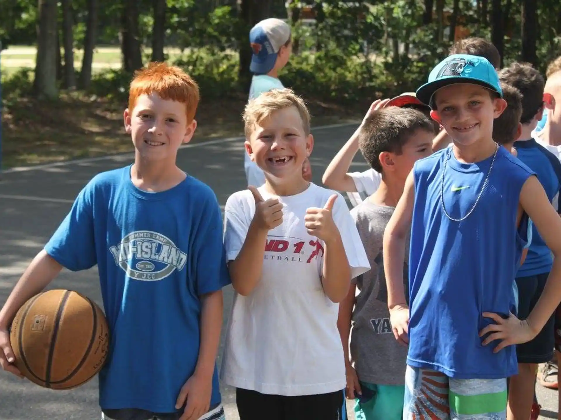 a group of boys holding a basketball