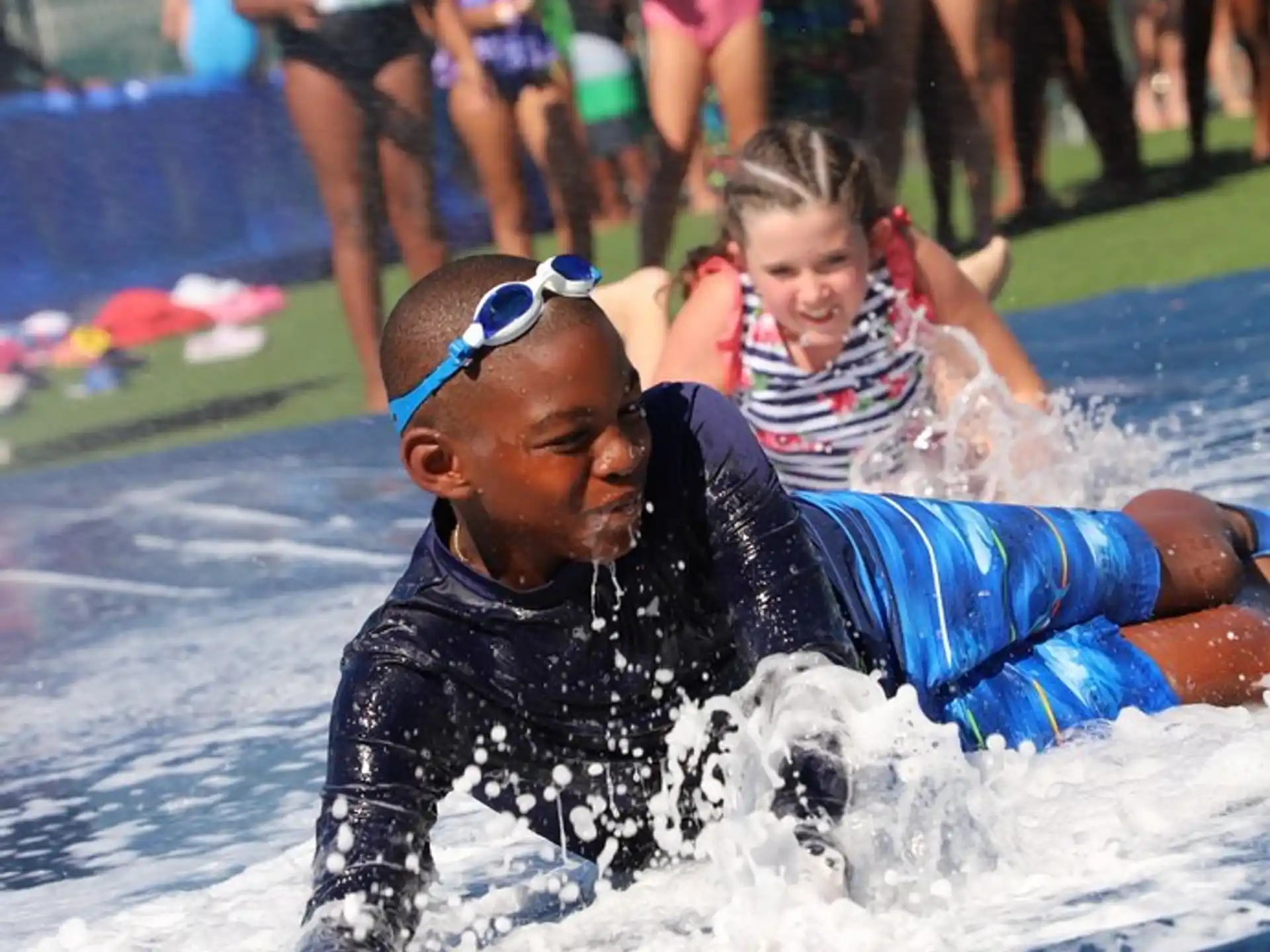 a person and a child in a pool