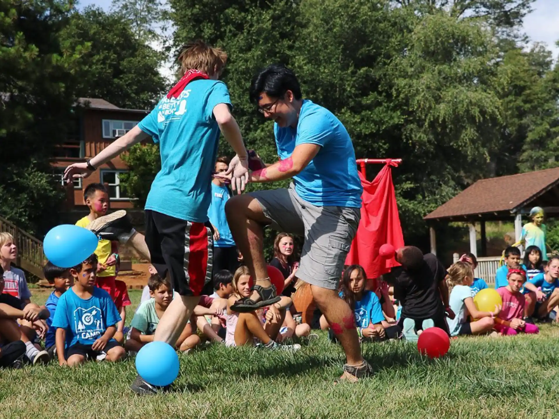 a couple of men playing with a child