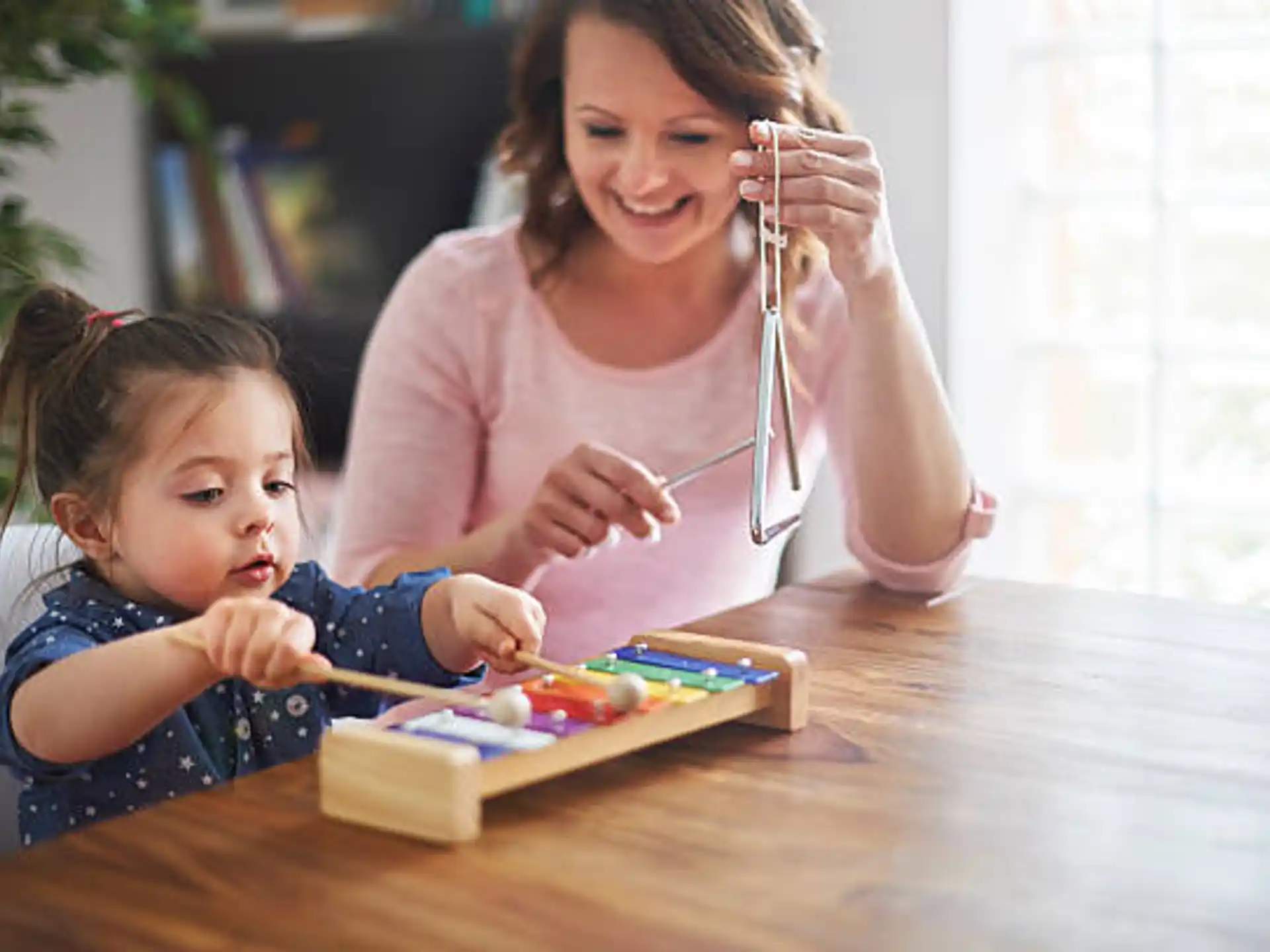 a person and a child painting