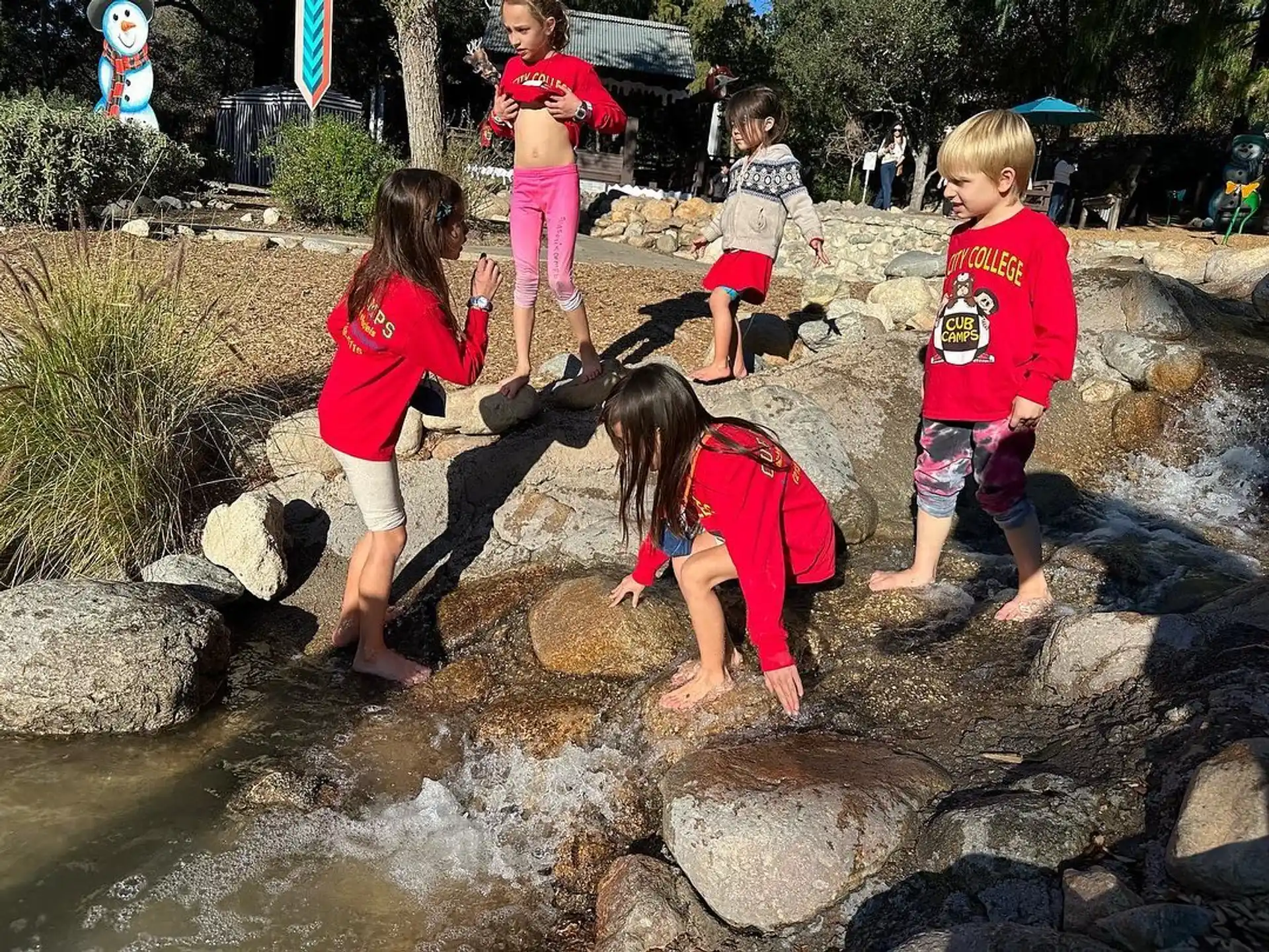 children playing in a stream