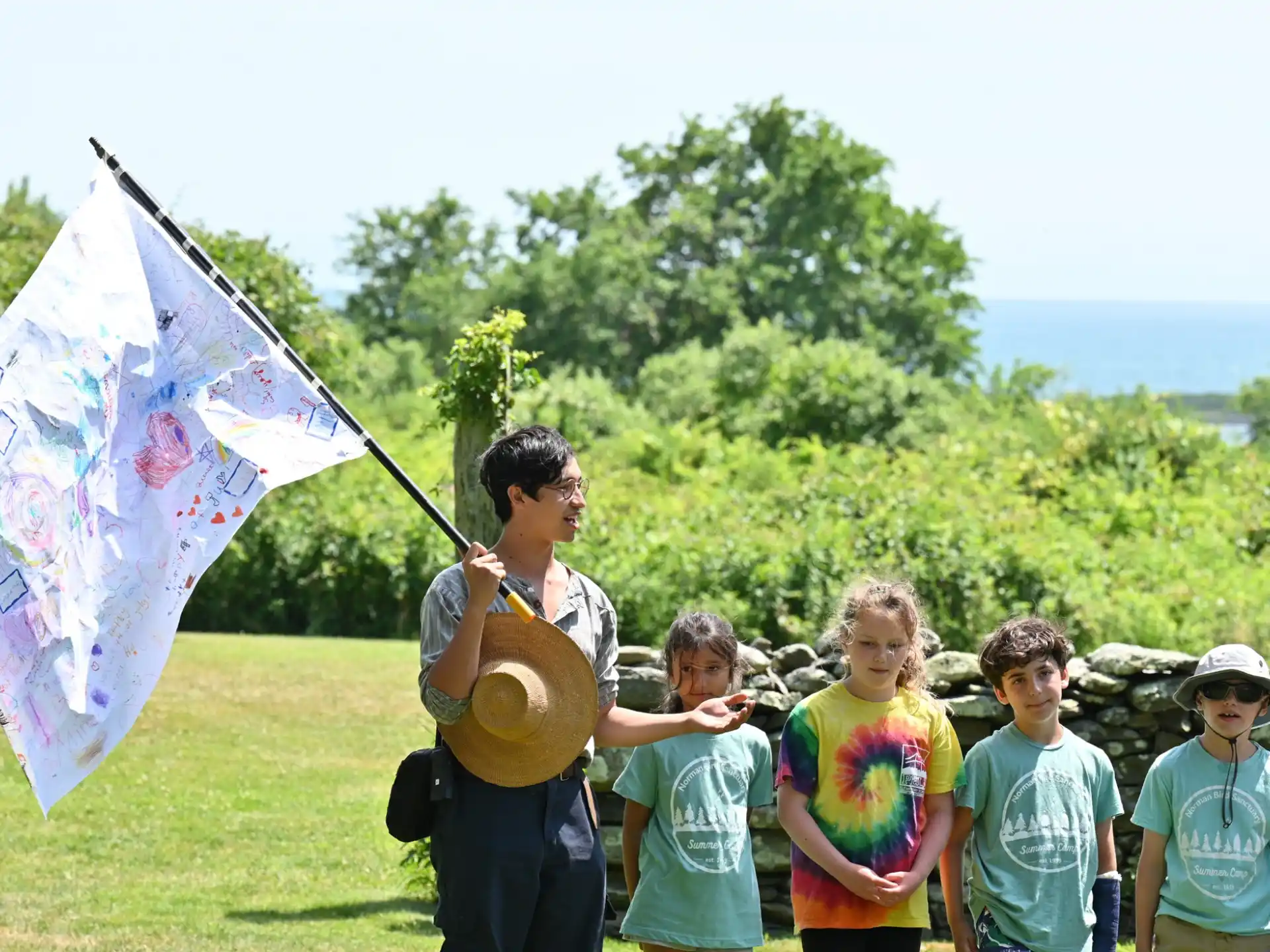 a group of kids flying a kite
