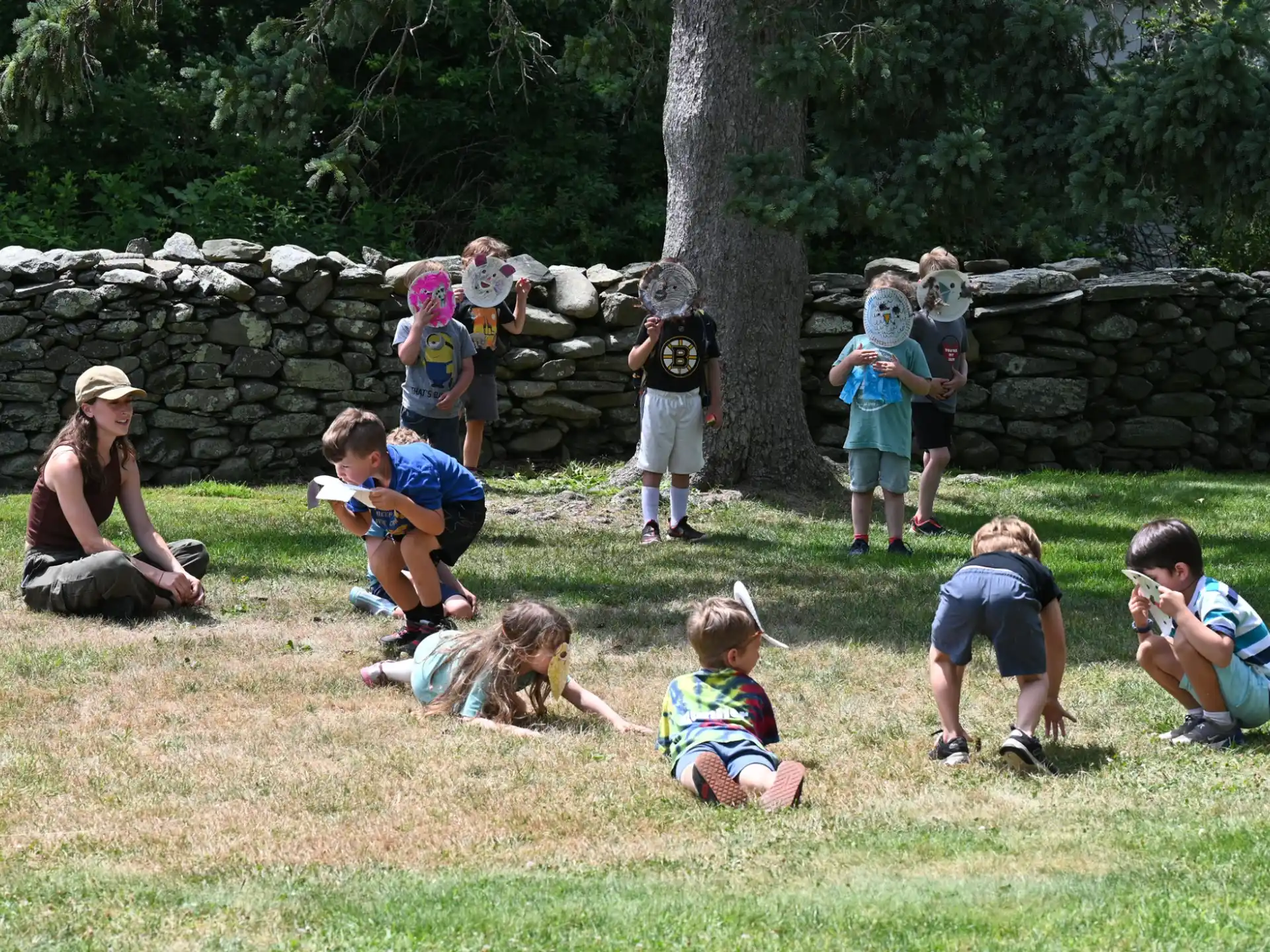 a group of people playing in the grass