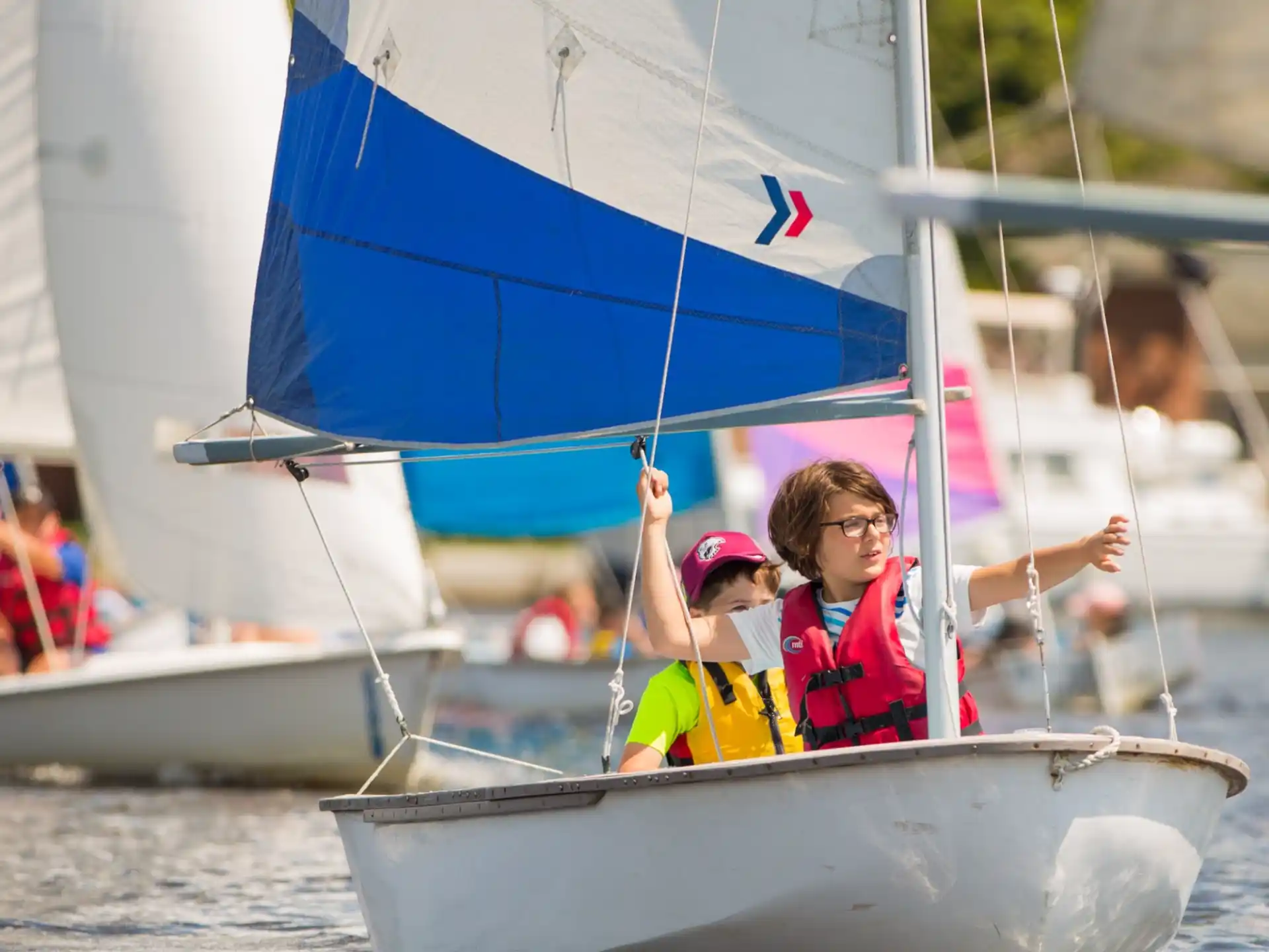 a group of people on a sailboat
