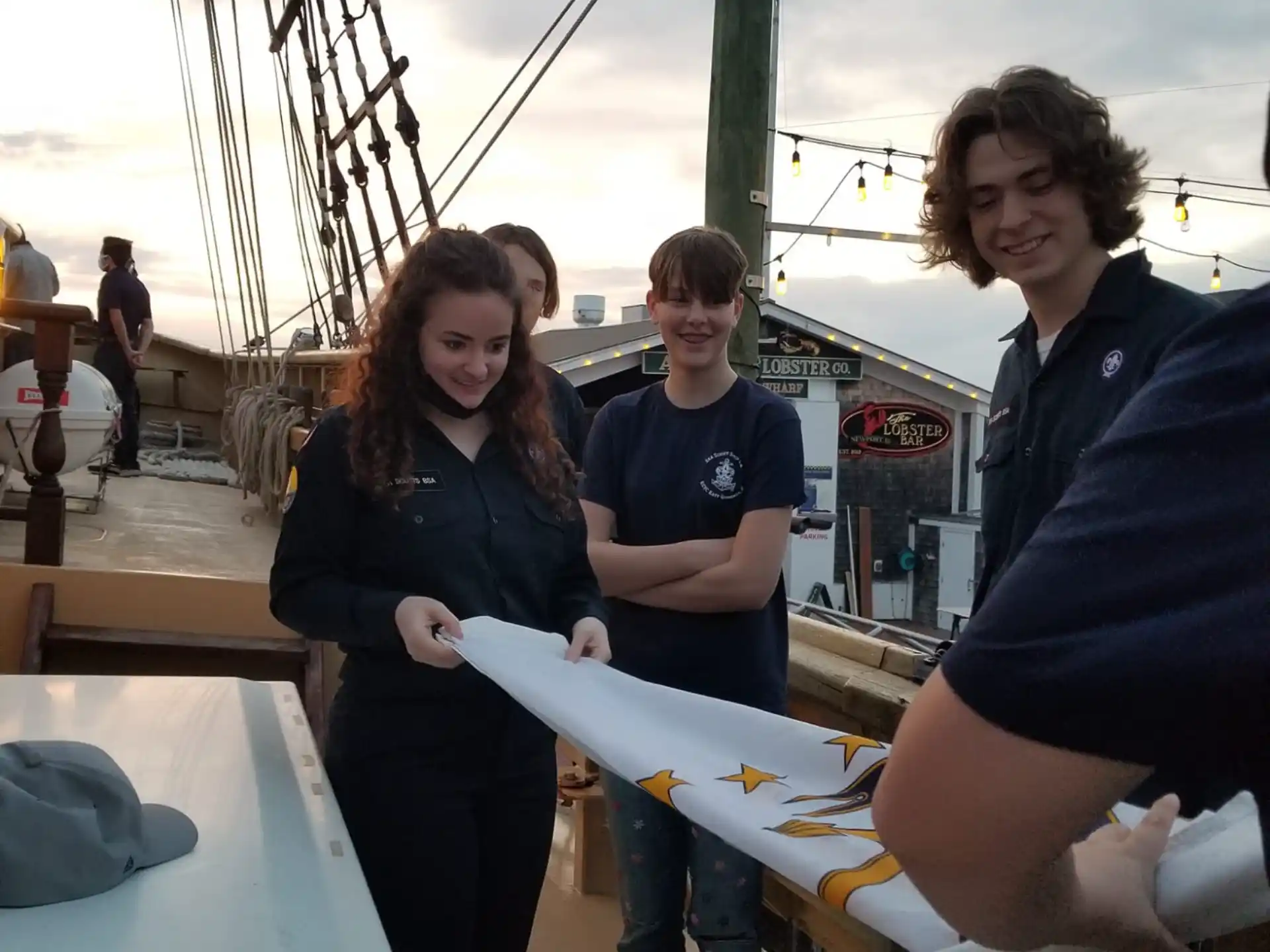 a group of people standing on a boat