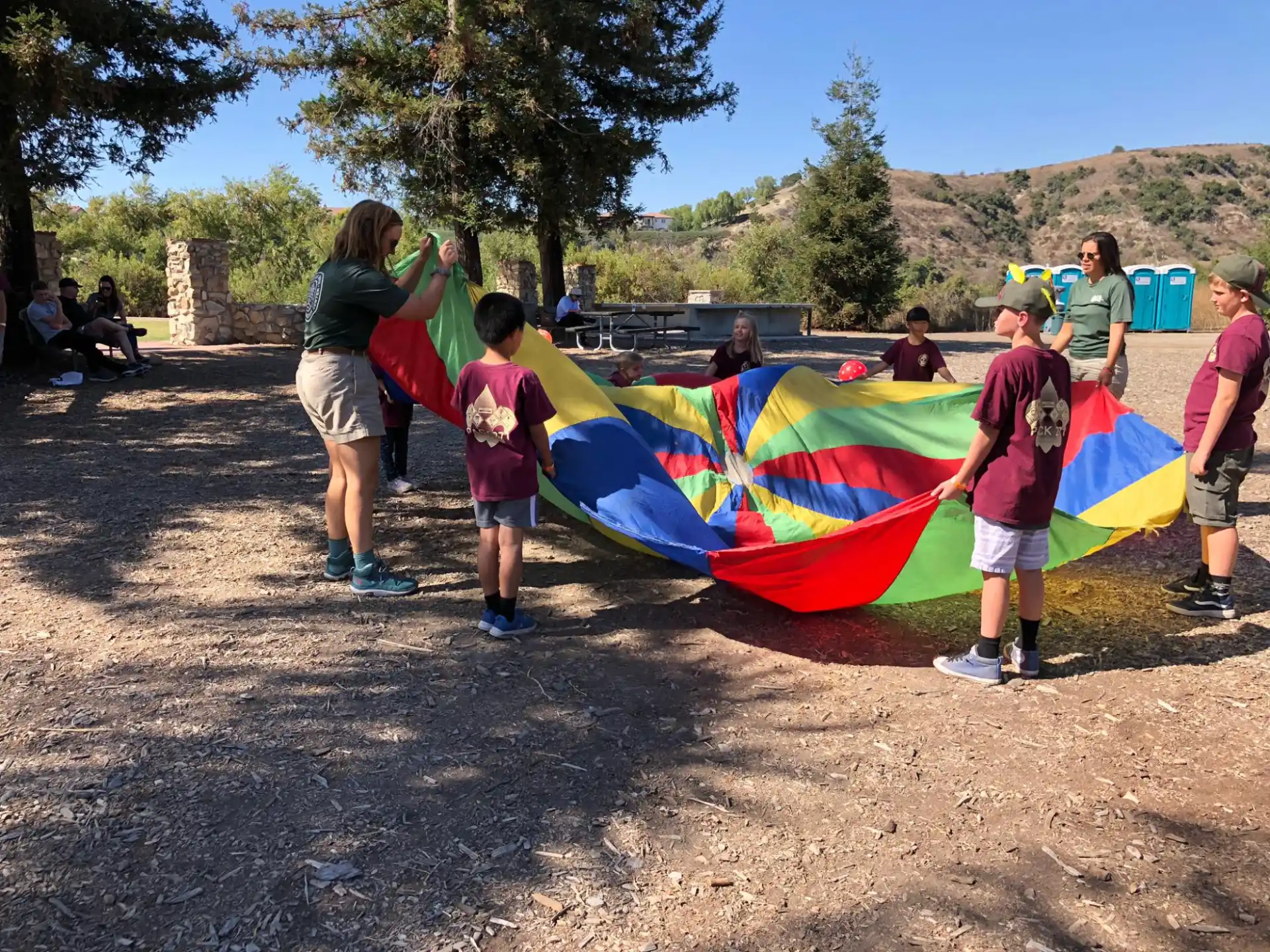 a group of people holding a kite