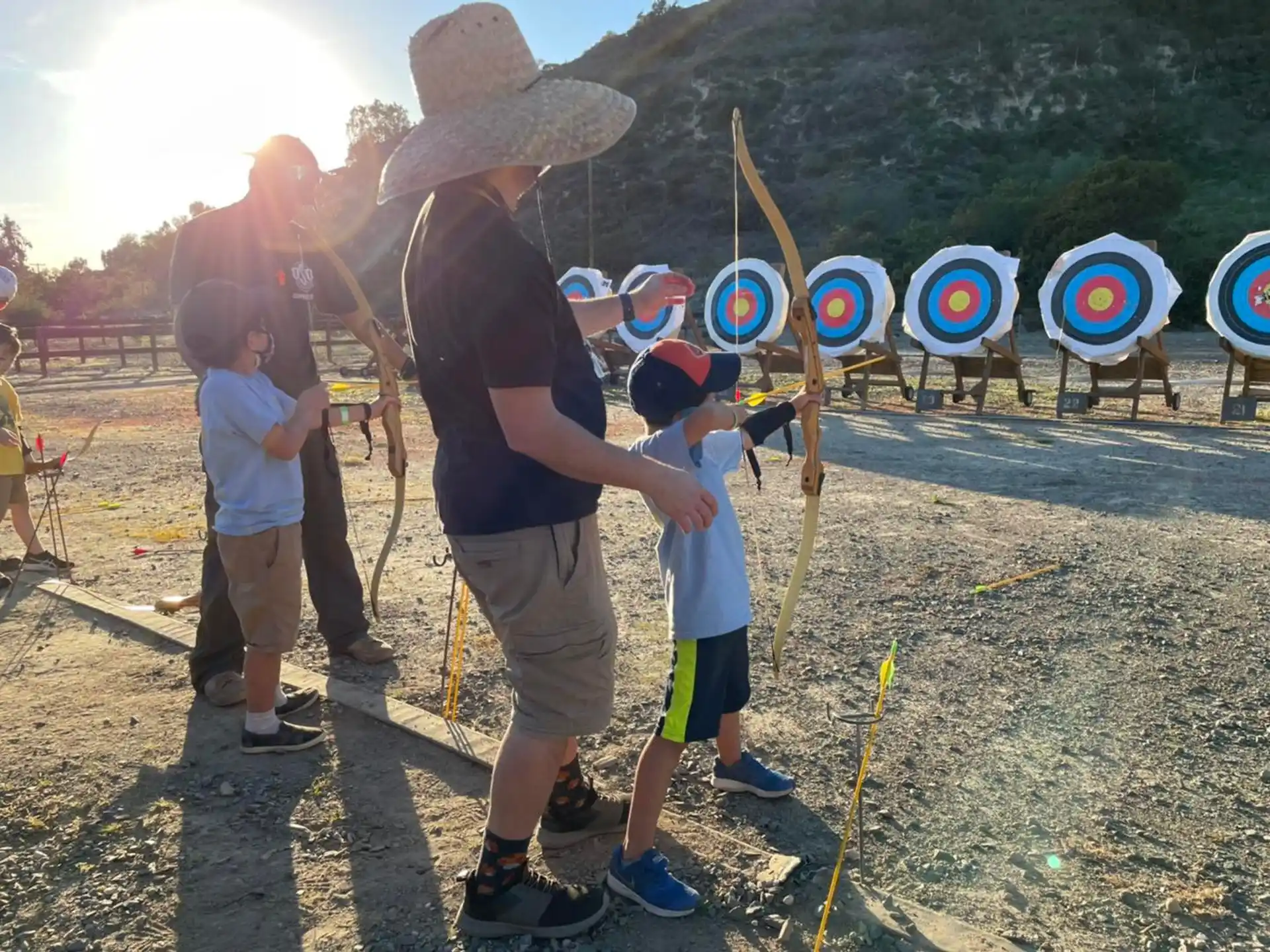 a group of people holding bows and arrows