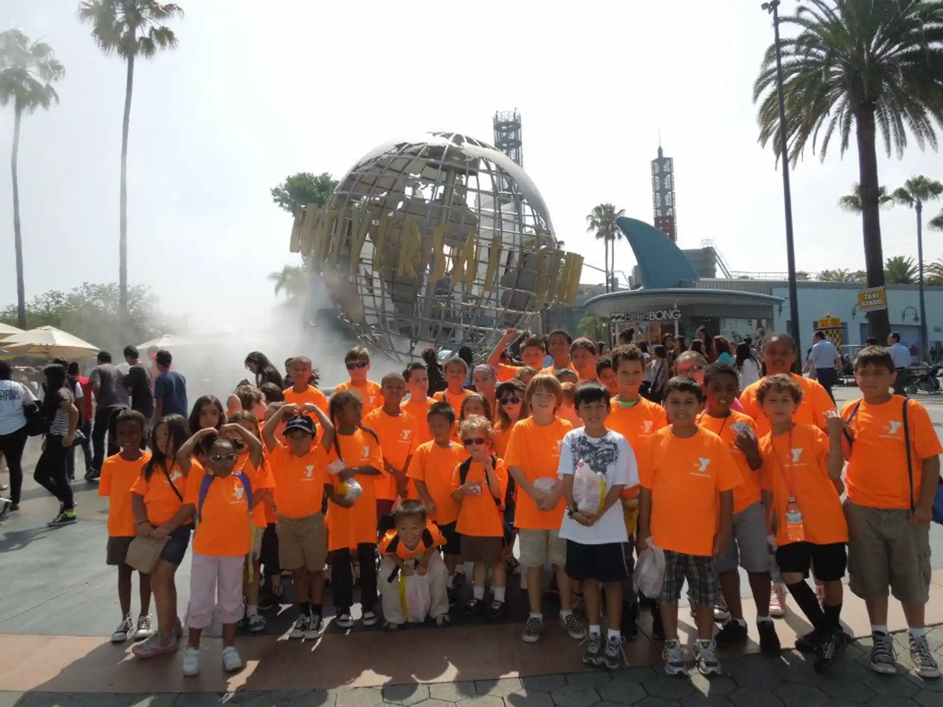 a group of people wearing orange shirts