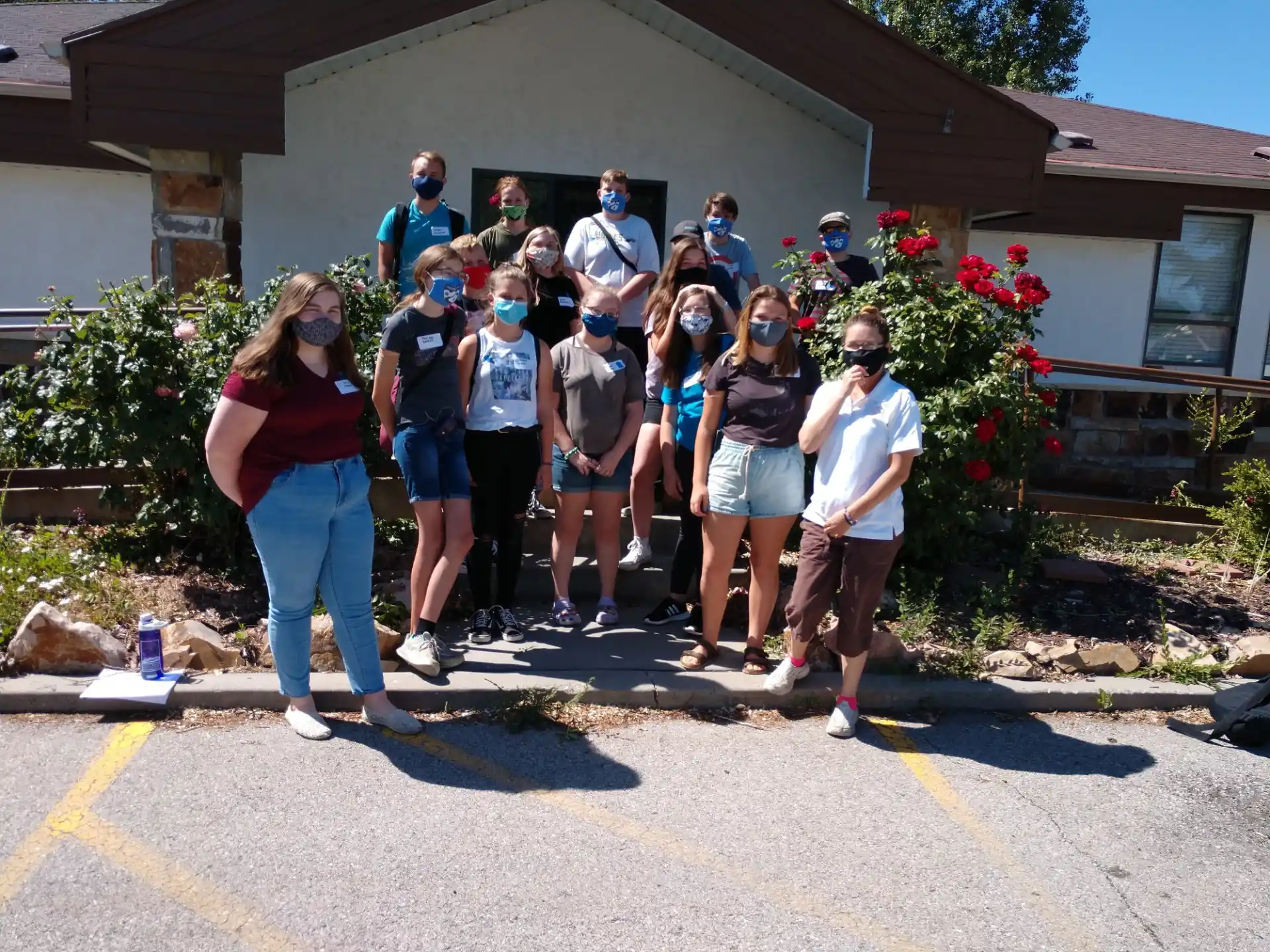 a group of people standing outside a house