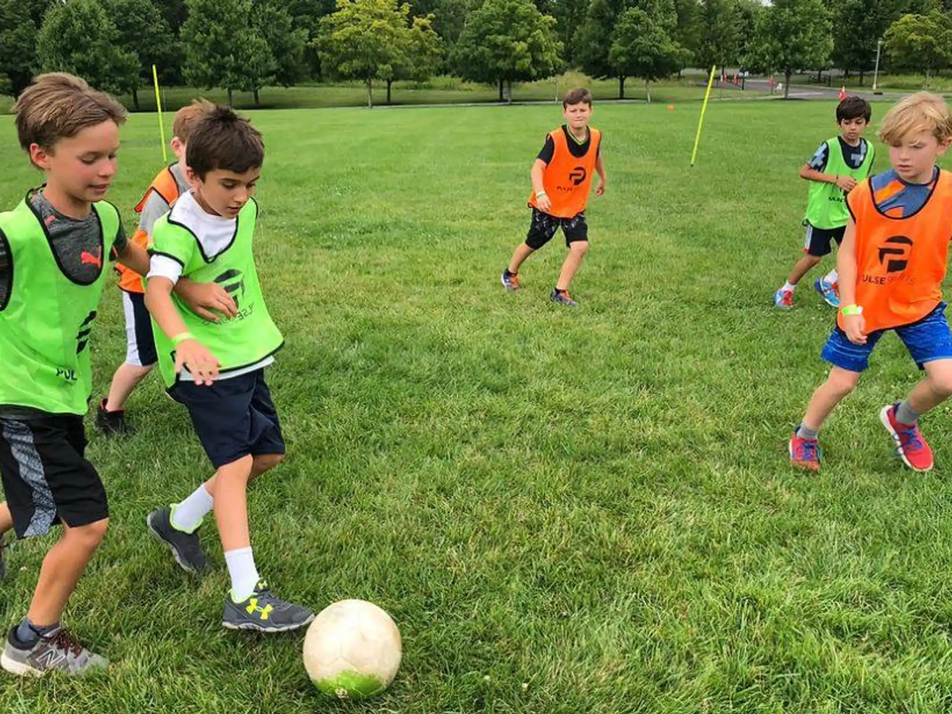 a group of kids playing football
