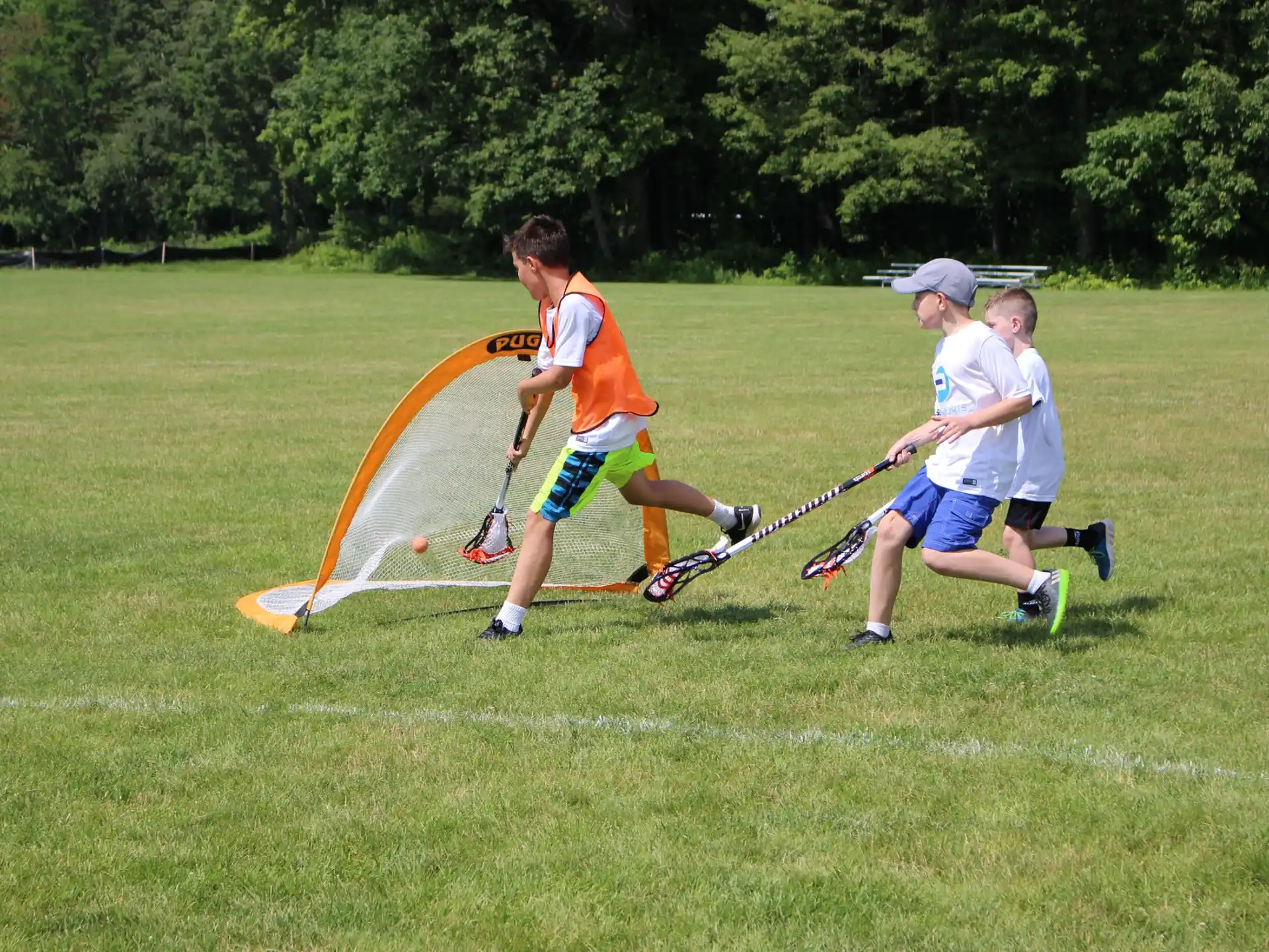 a group of men playing lacrosse