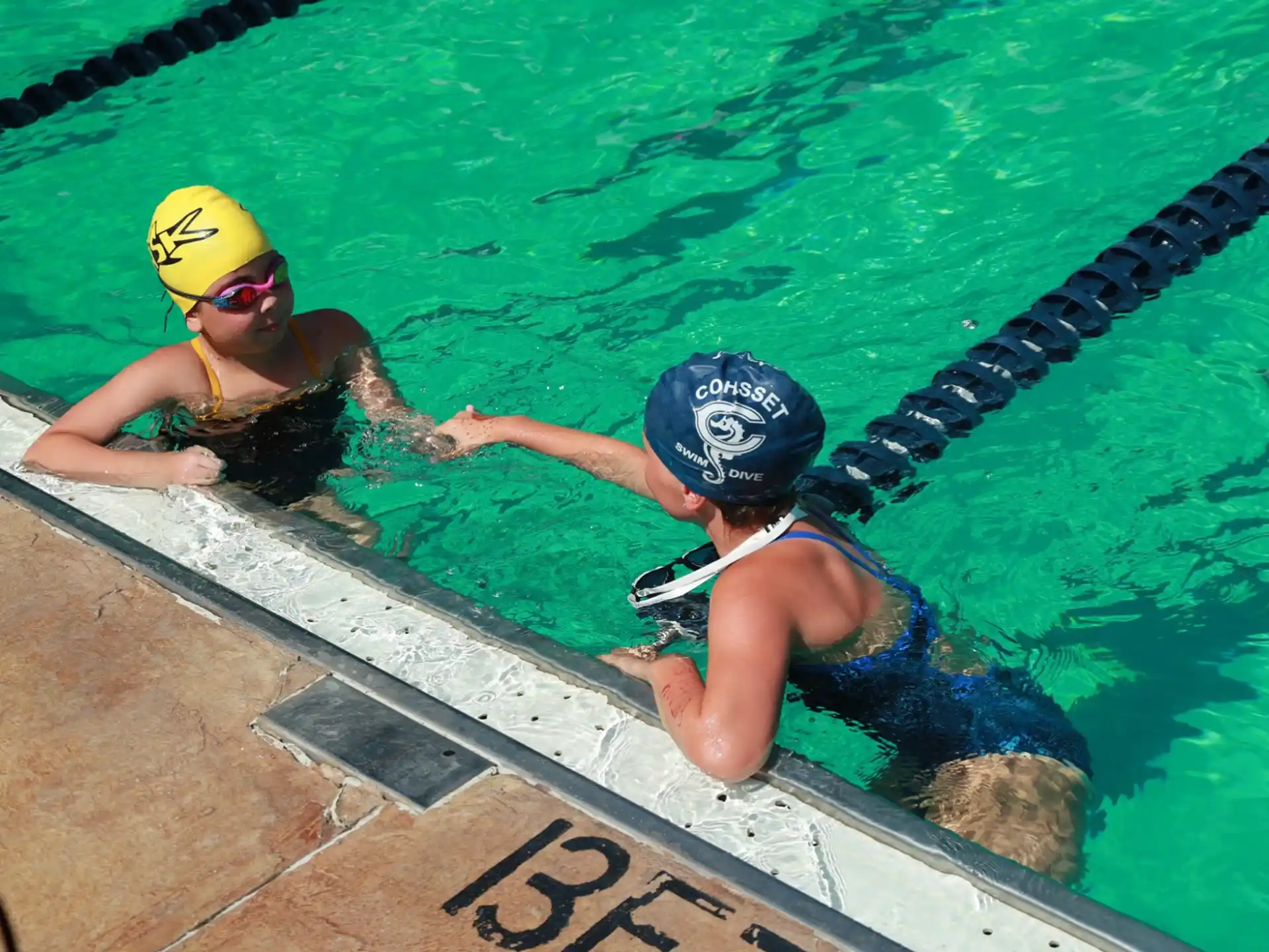 a couple of people in a pool