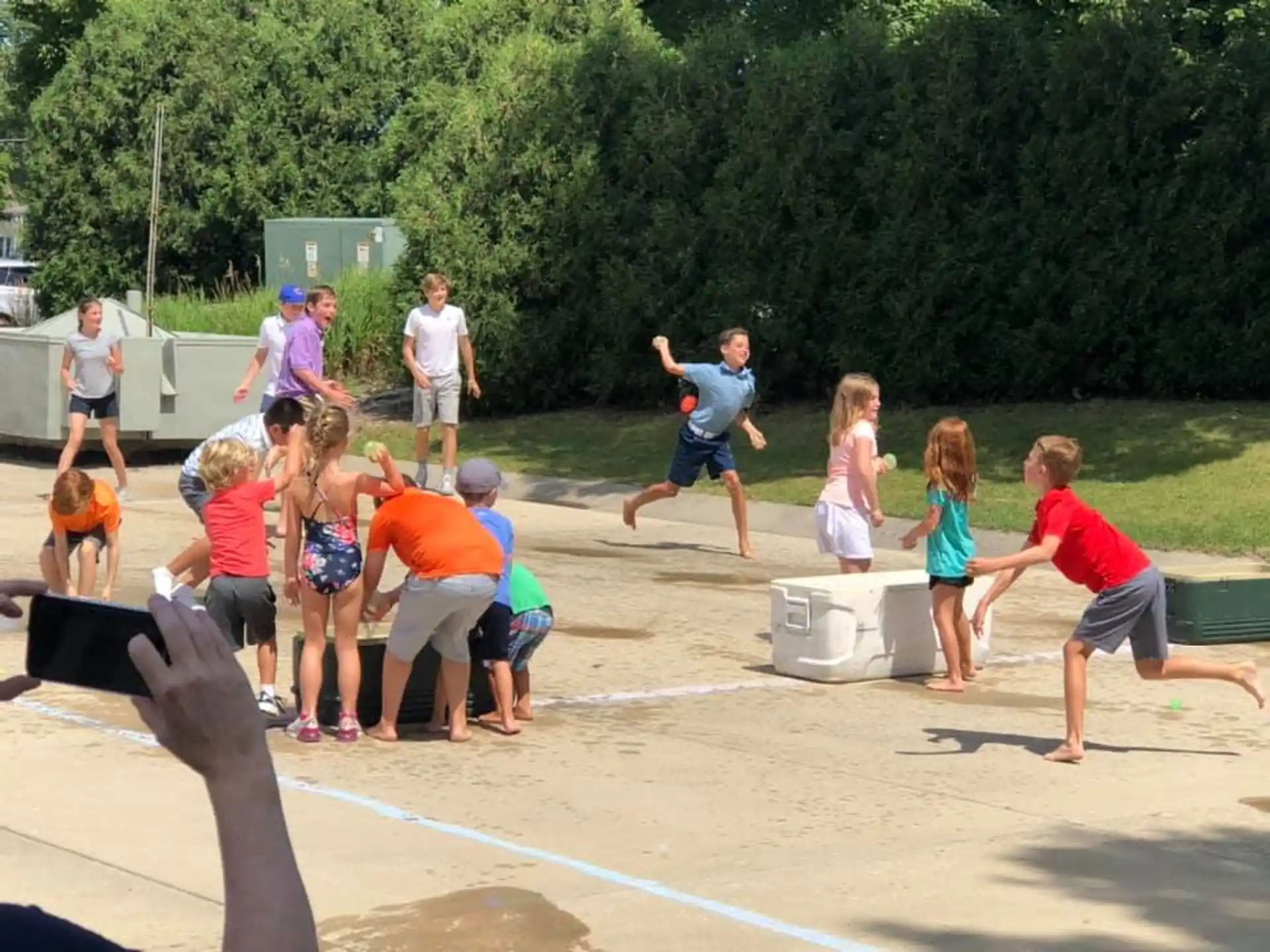 a group of people playing in a sand pit