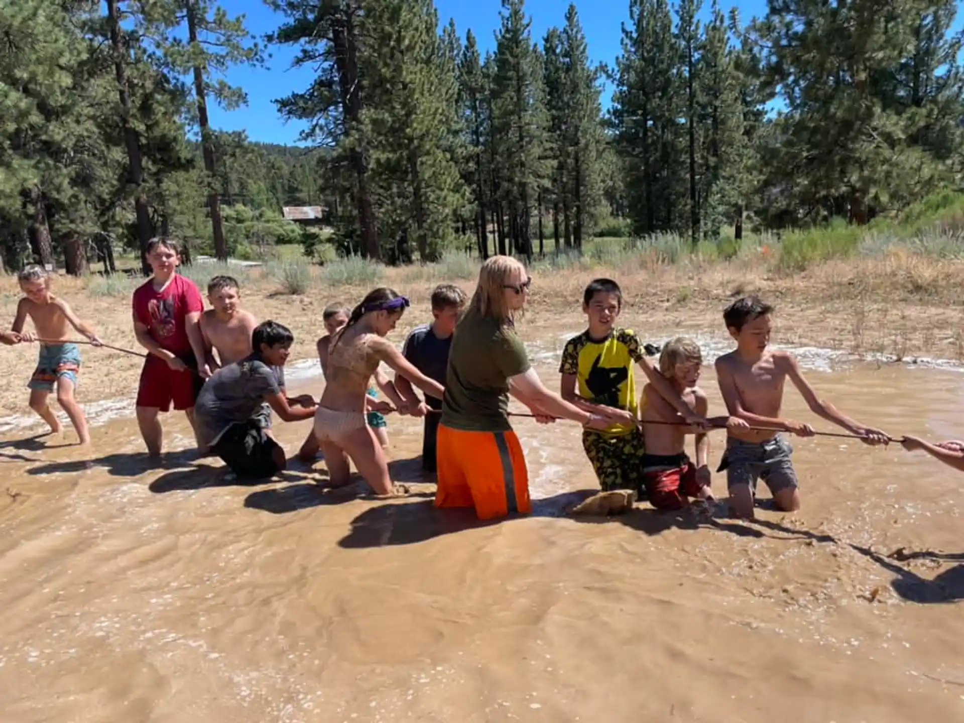 a group of people playing in the sand