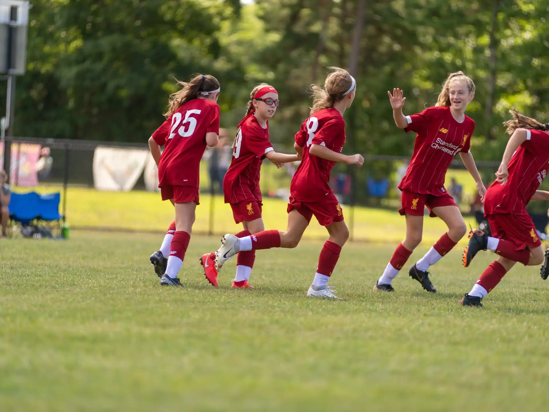 a group of girls playing football