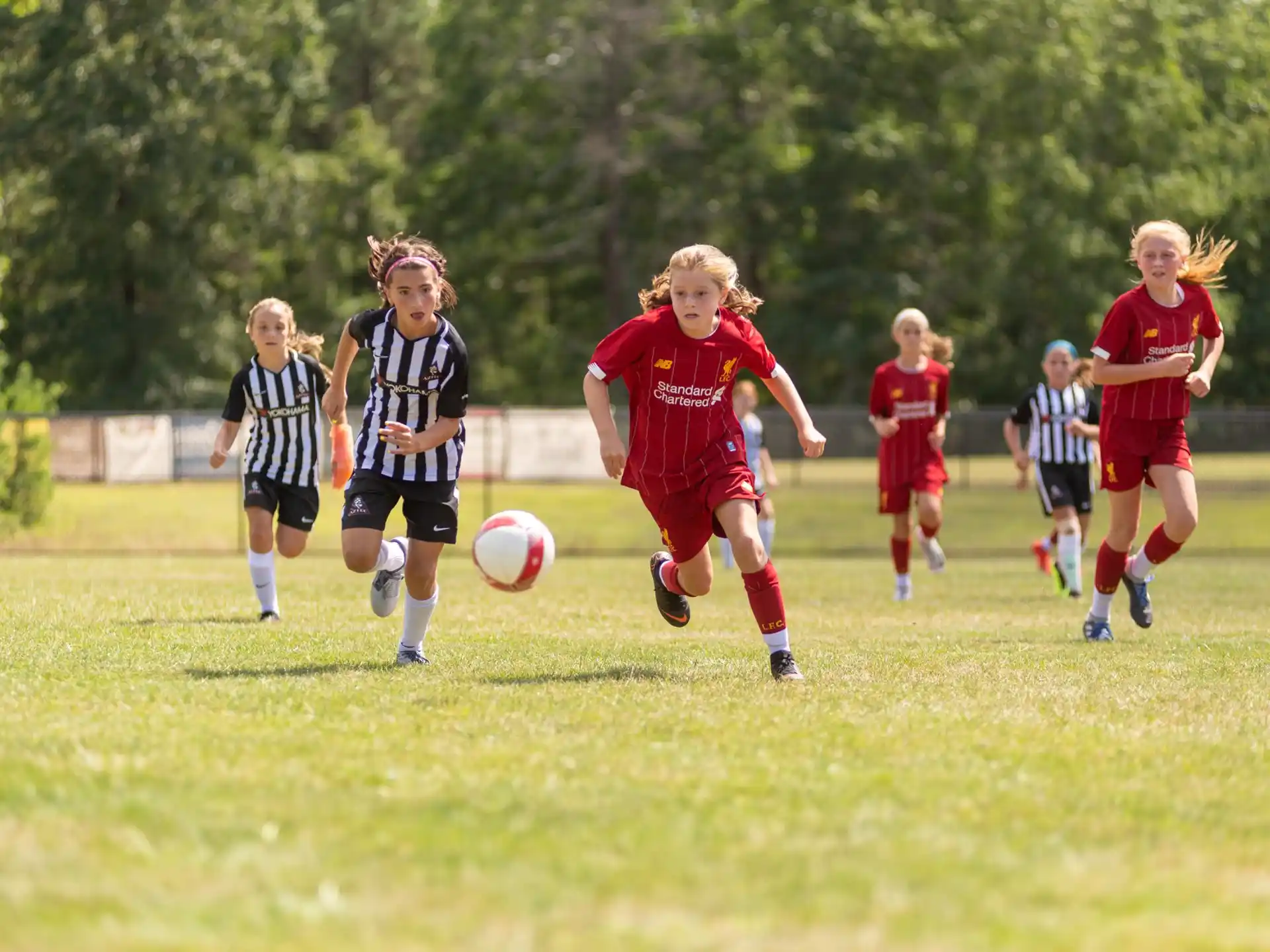 a group of girls playing football