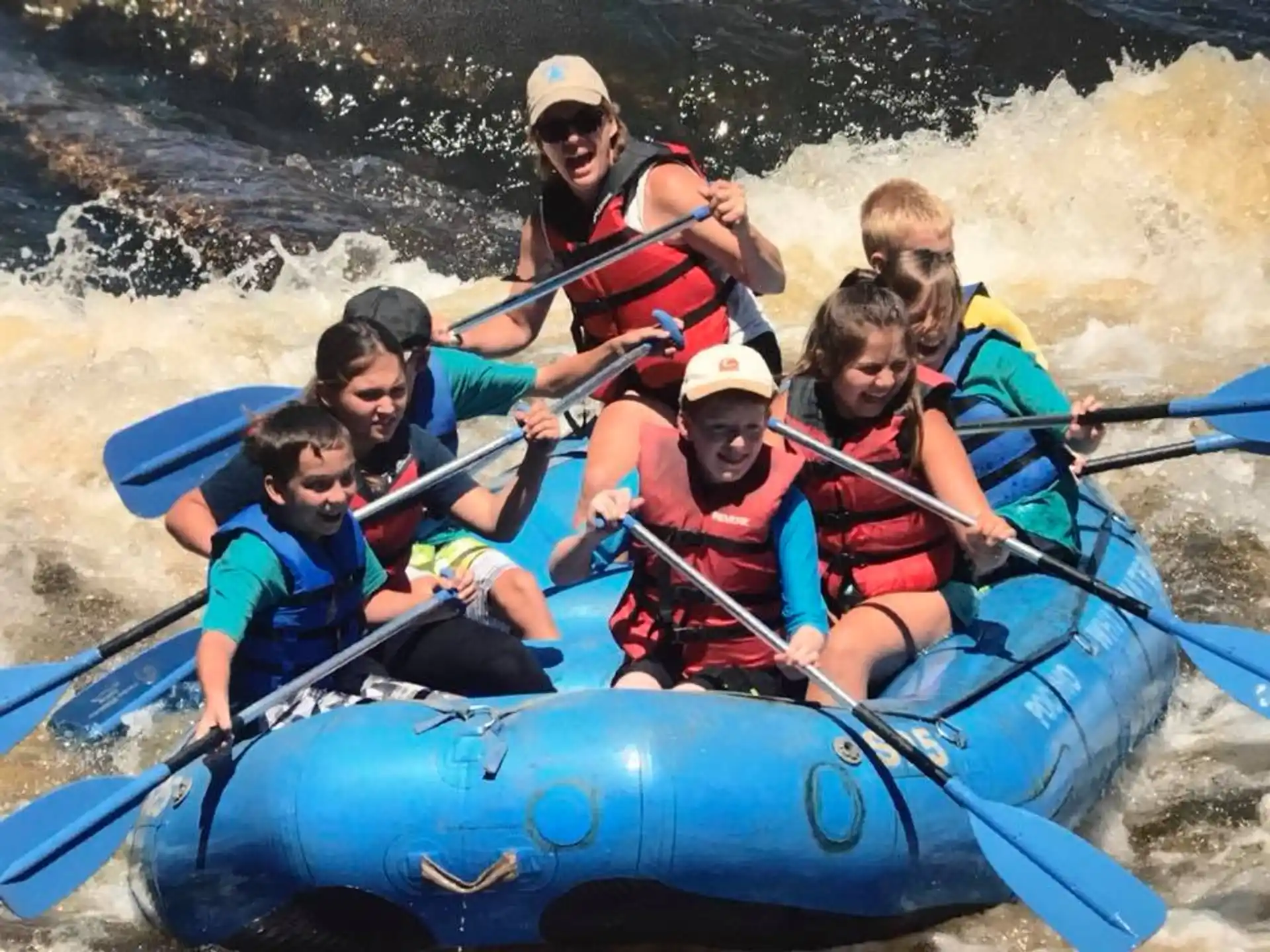 a group of people in a raft