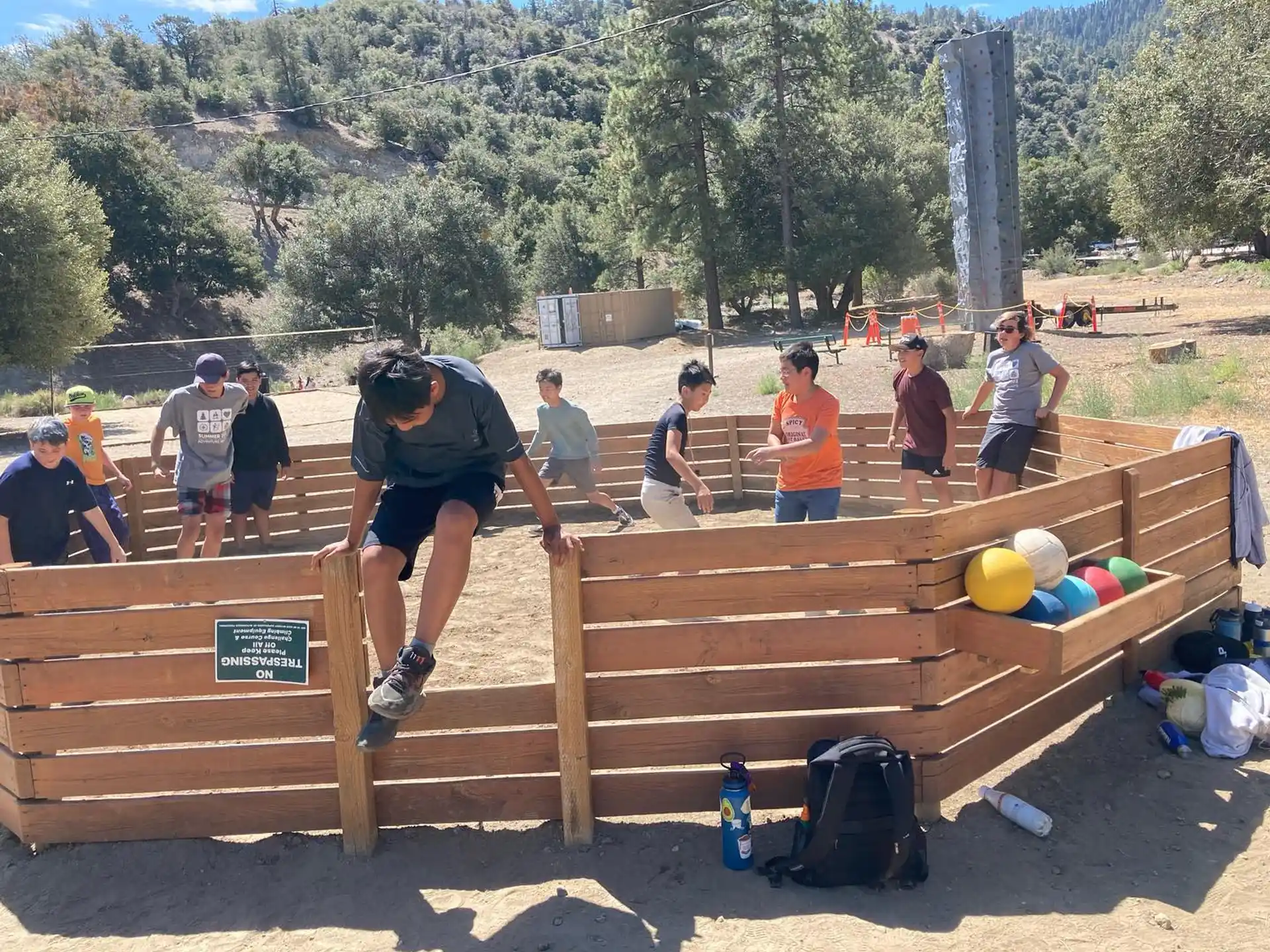 a group of people playing on a wooden bench