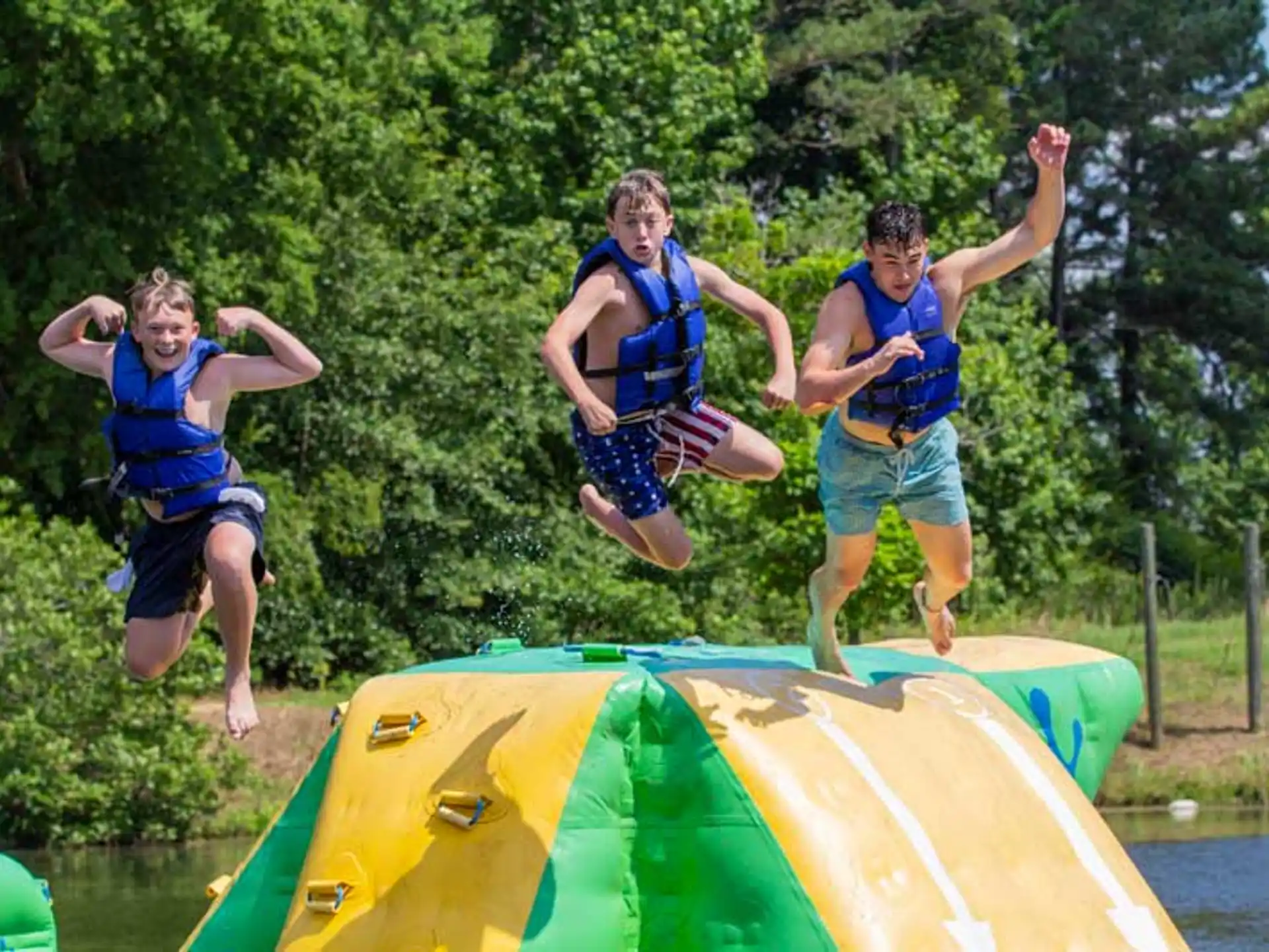 a group of people jumping on a trampoline