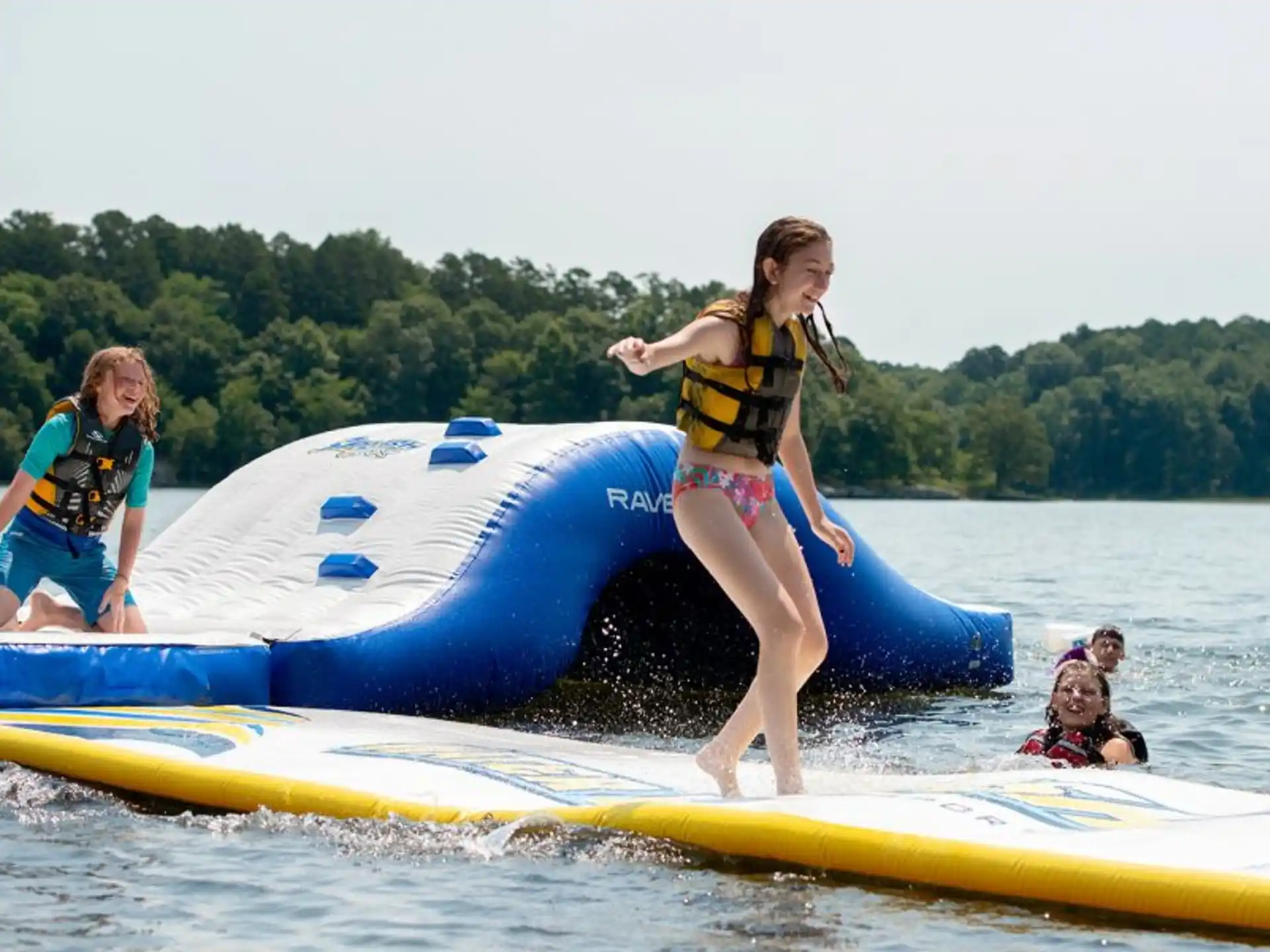 a group of people on a surfboard in the water