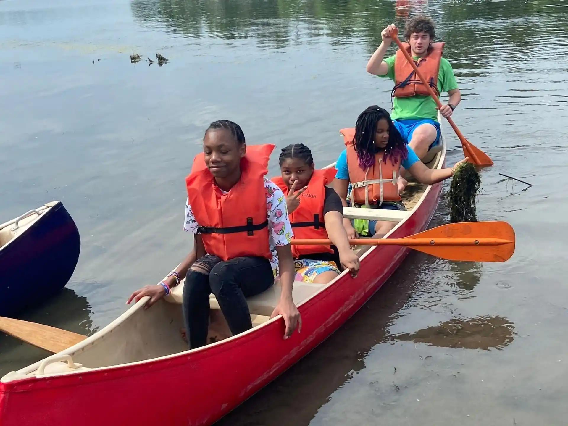 a group of people in a canoe