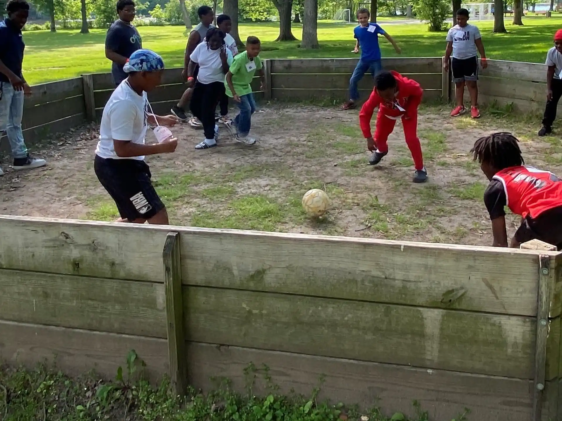 a group of people playing with a ball