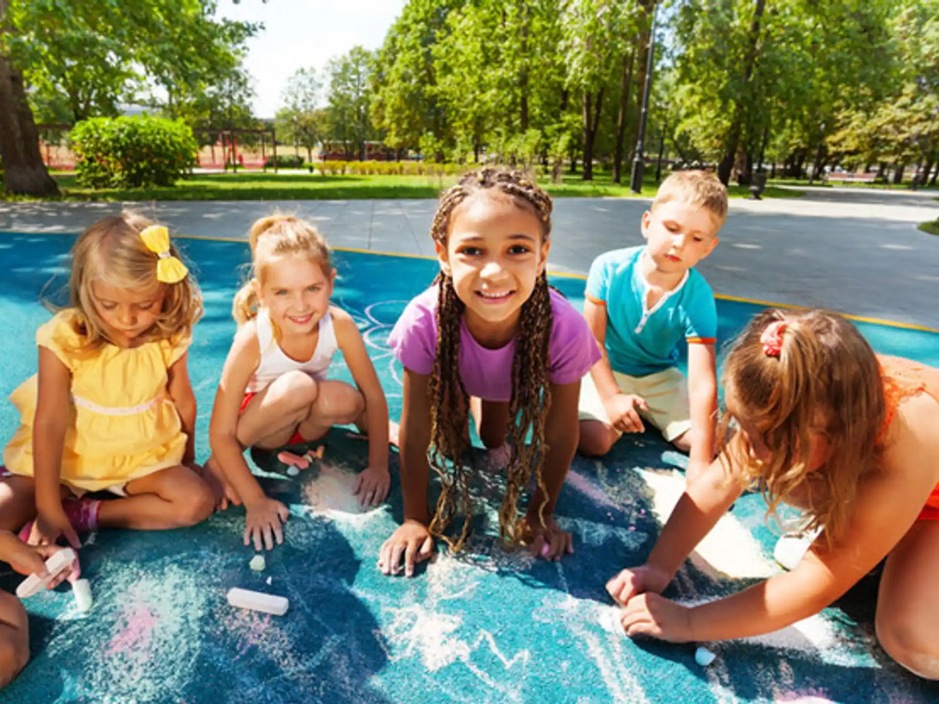 a group of children sitting in a pool