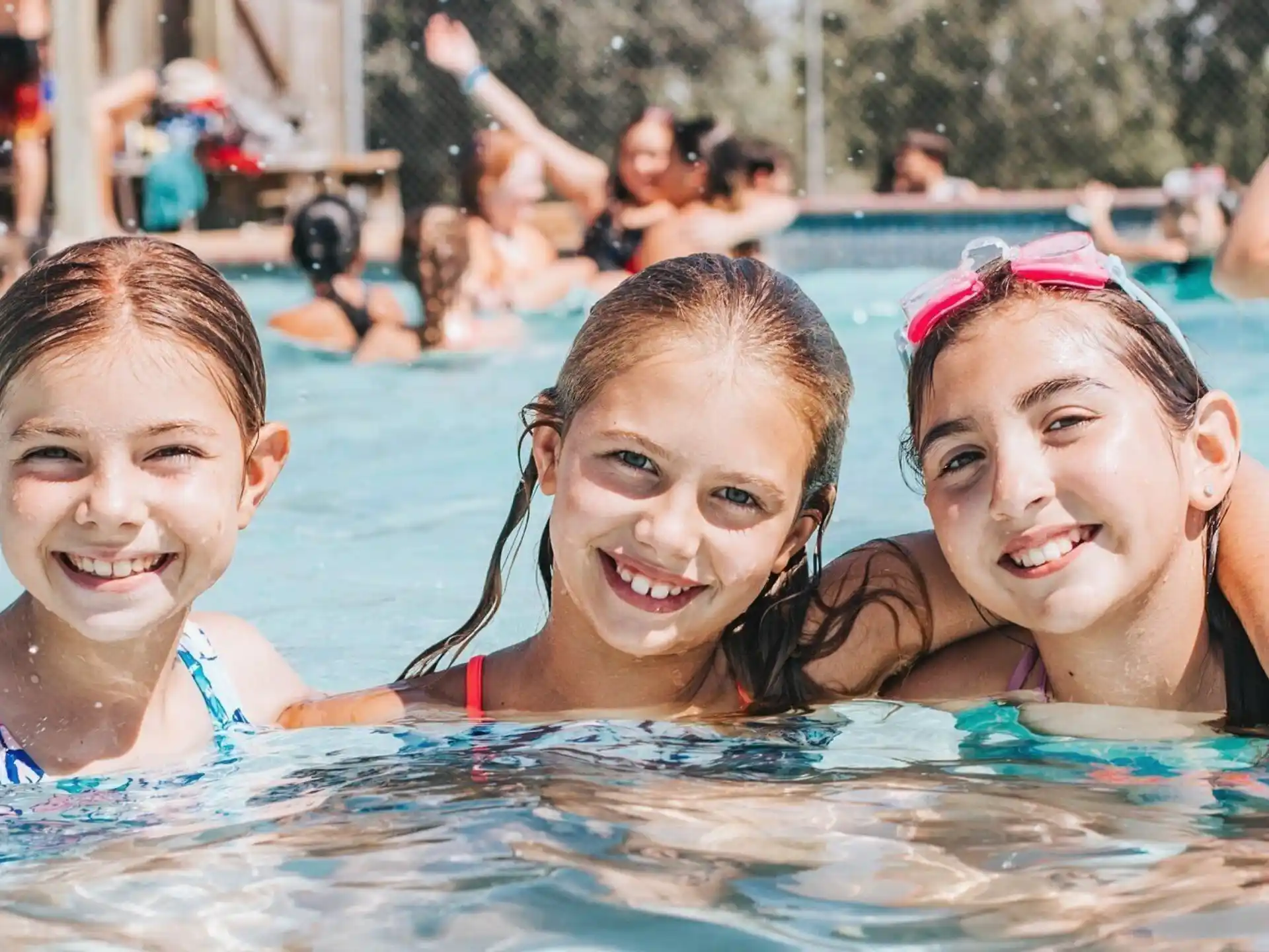 a group of girls in a pool