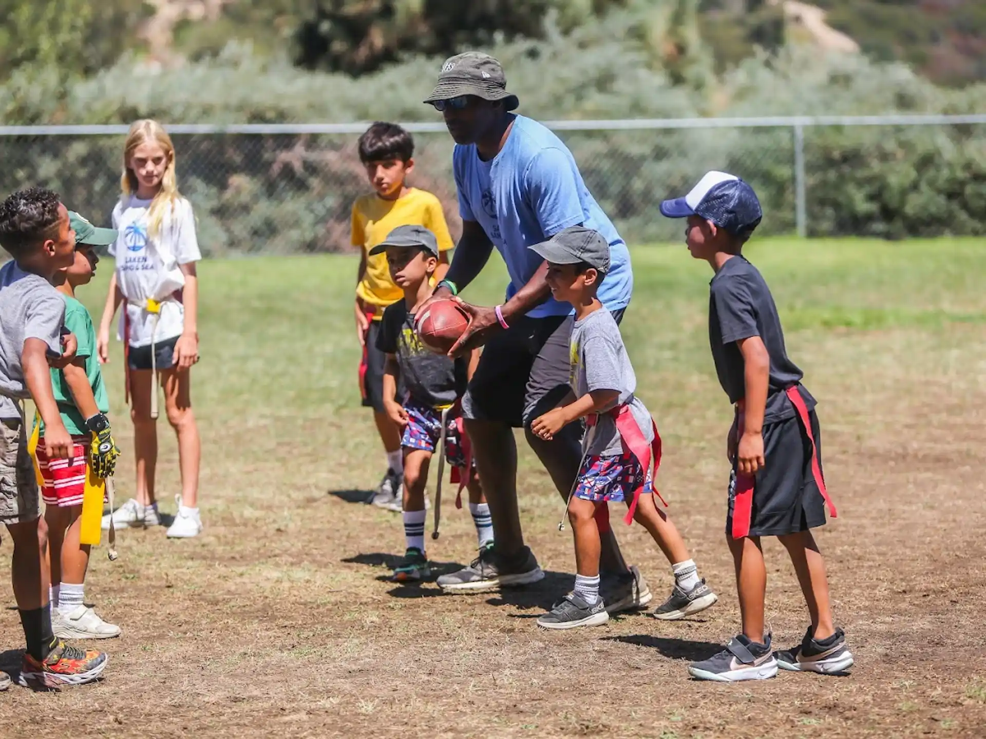 a group of kids playing football