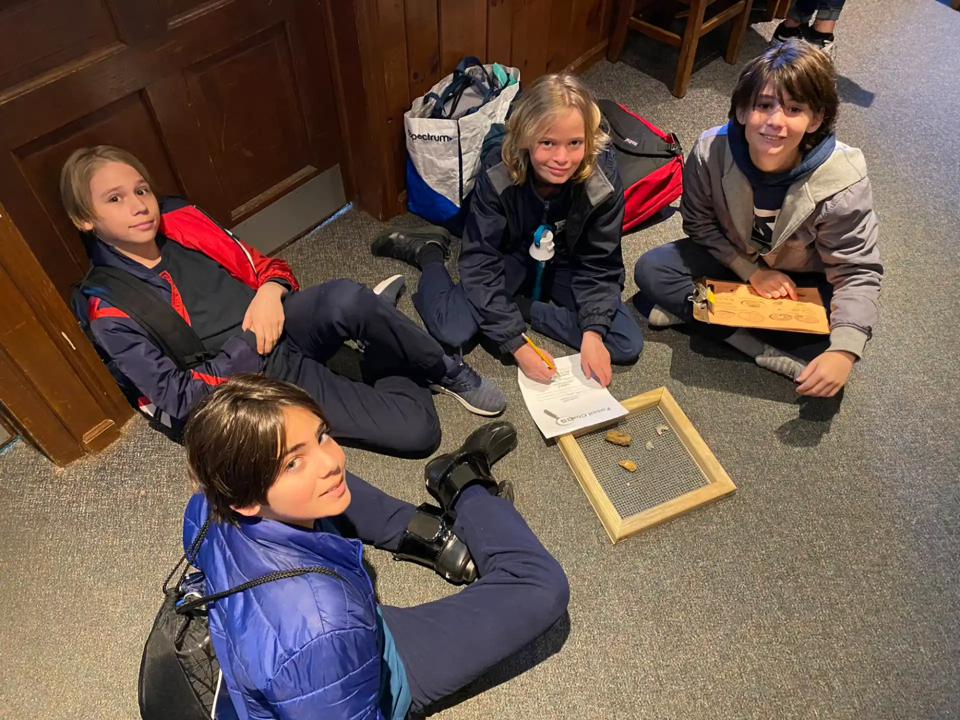 a group of children sitting on the floor