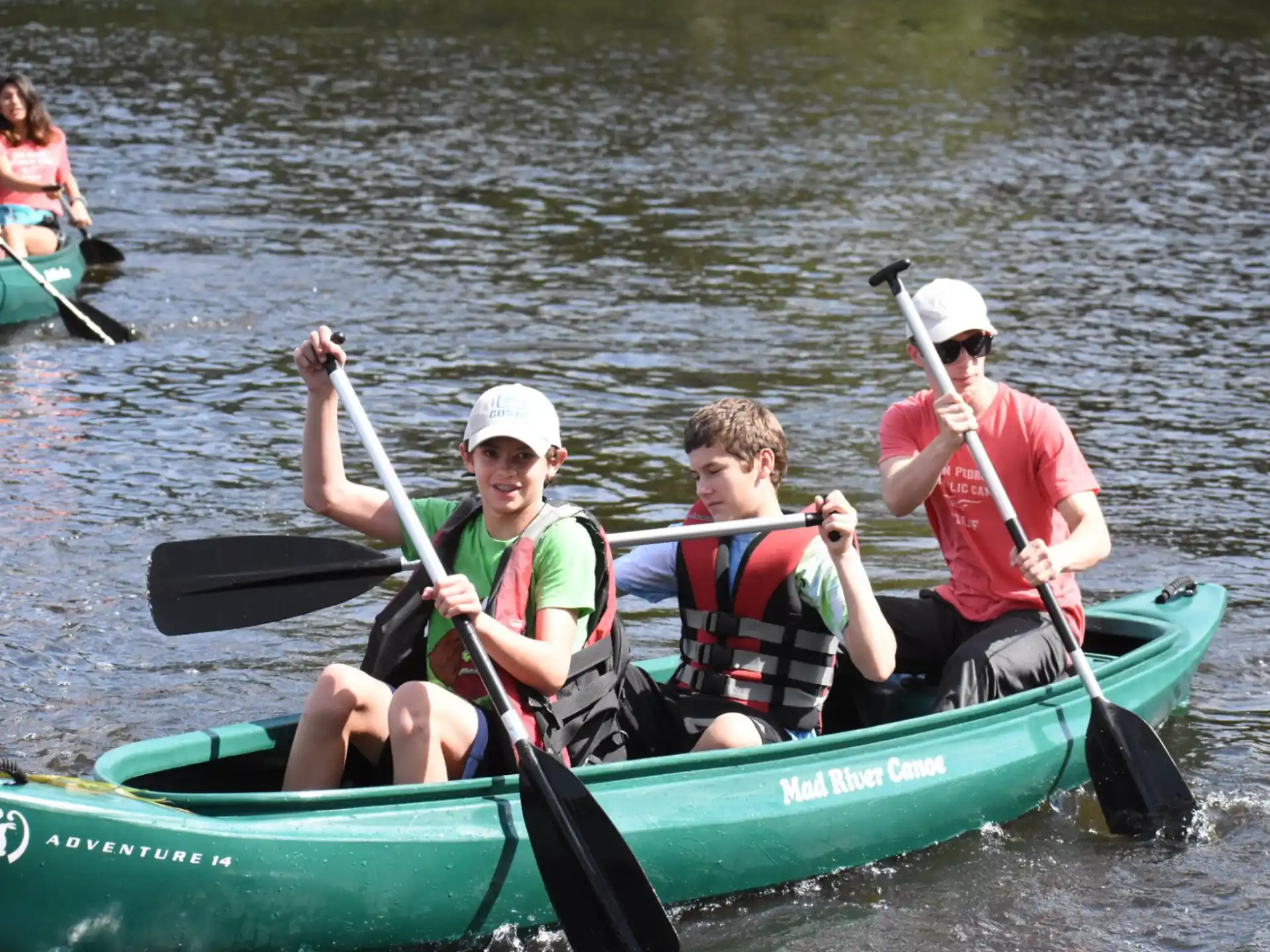 a group of people in a canoe