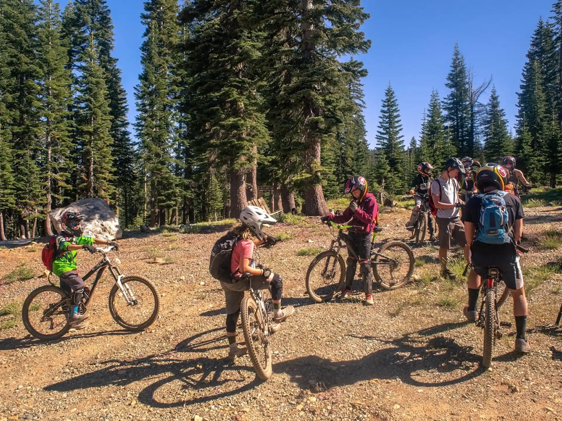 a group of people riding bikes