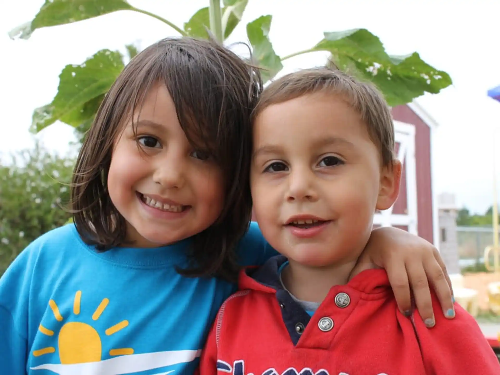 a couple of children posing for the camera