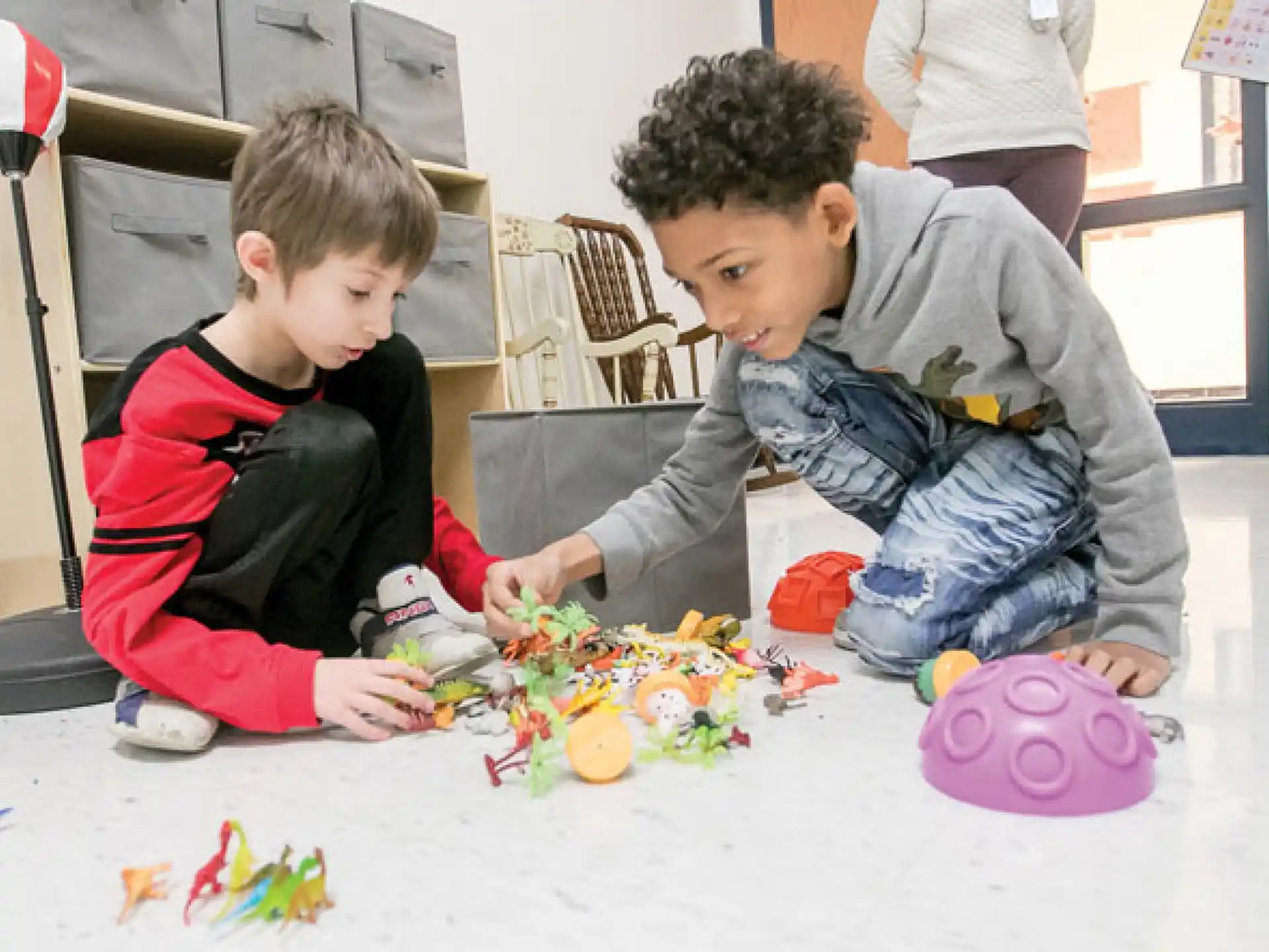 a couple of boys playing with toys