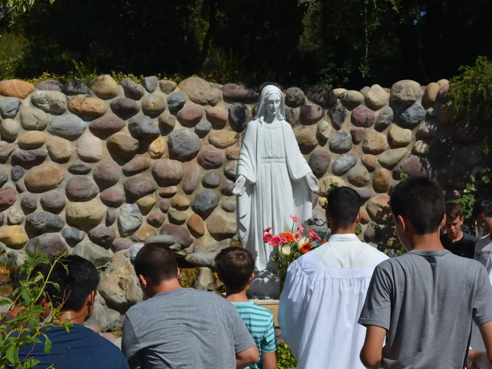 a group of people looking at a statue