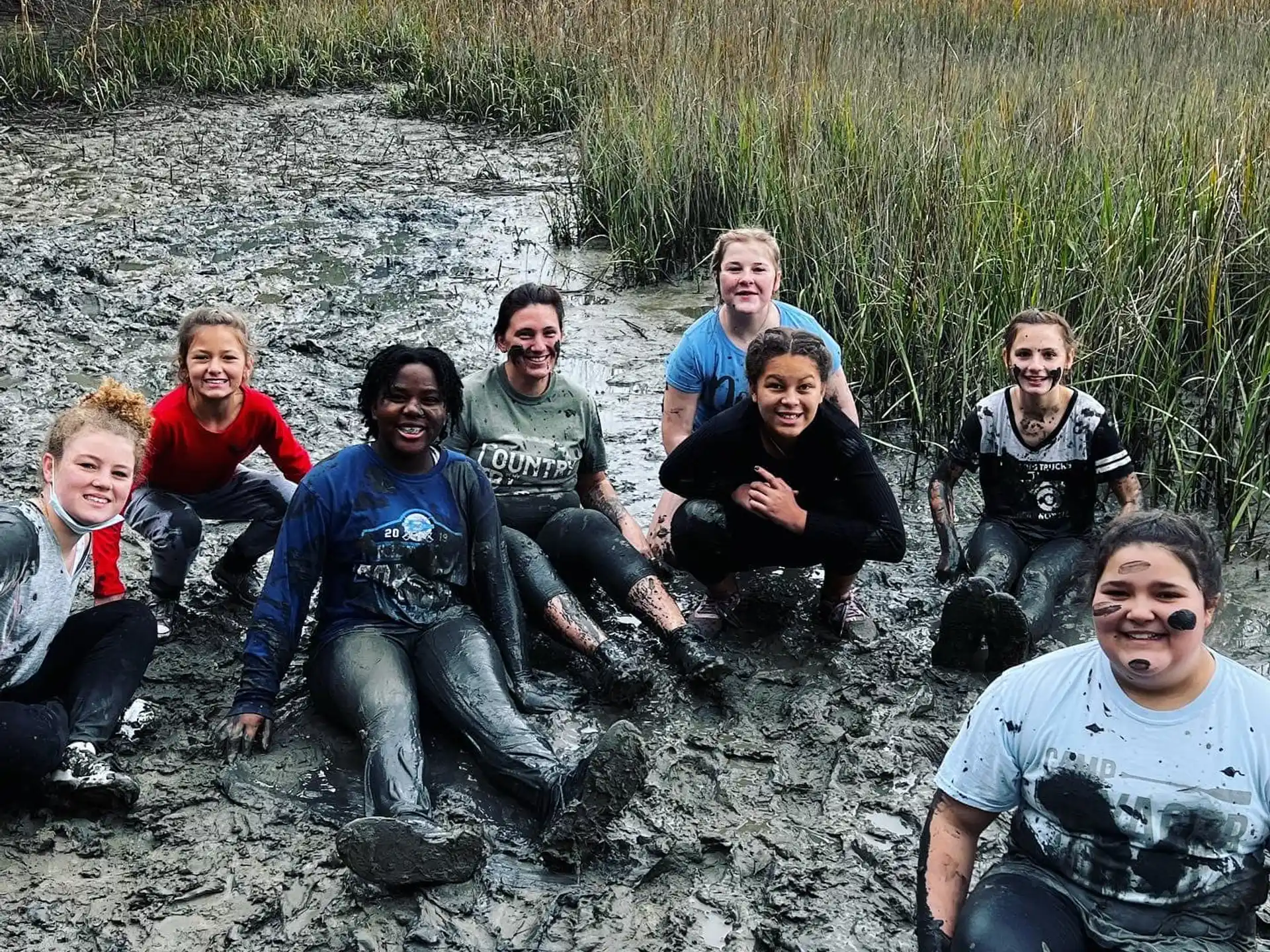 a group of people sitting in a river