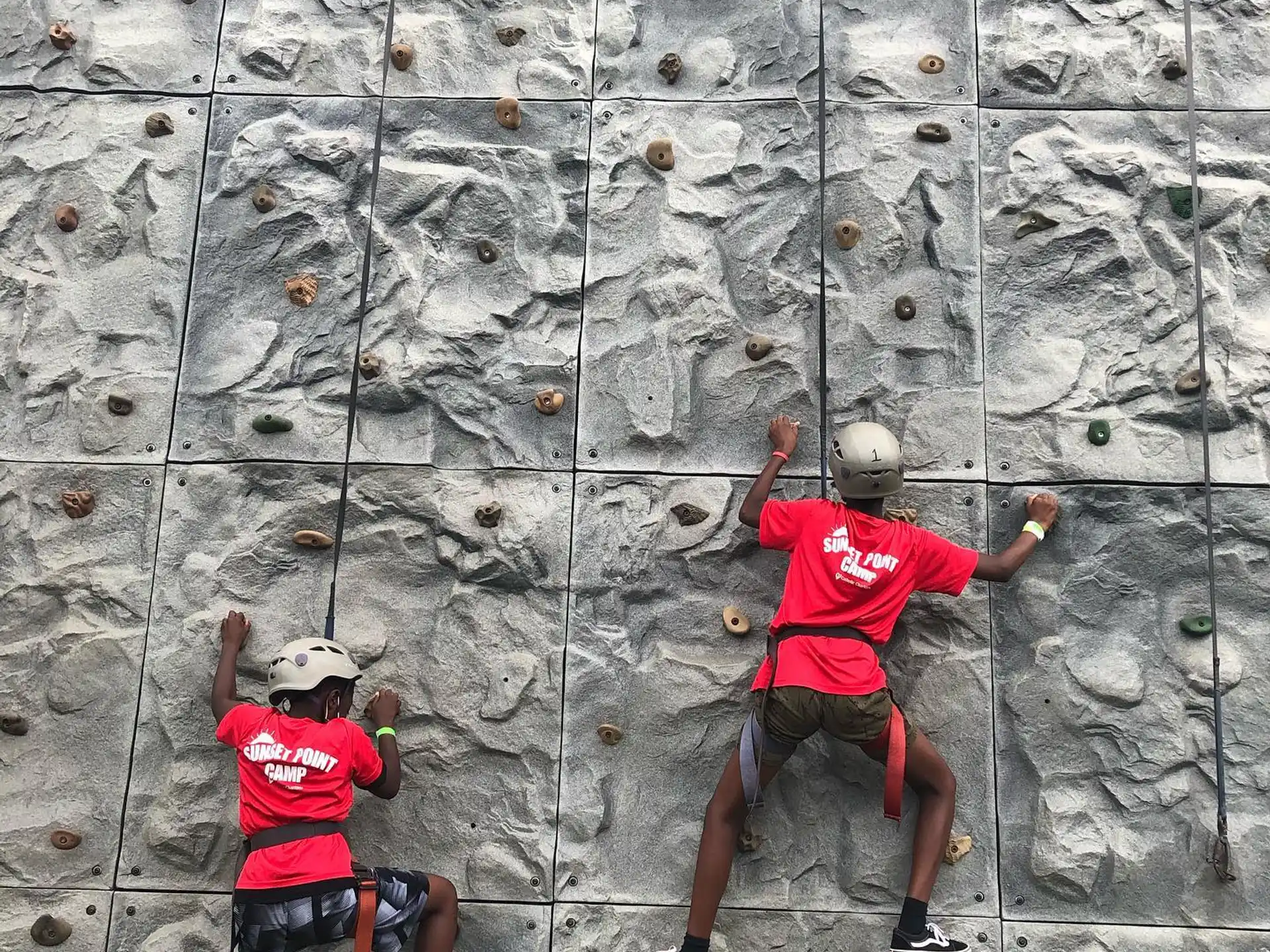 a man climbing a rock wall