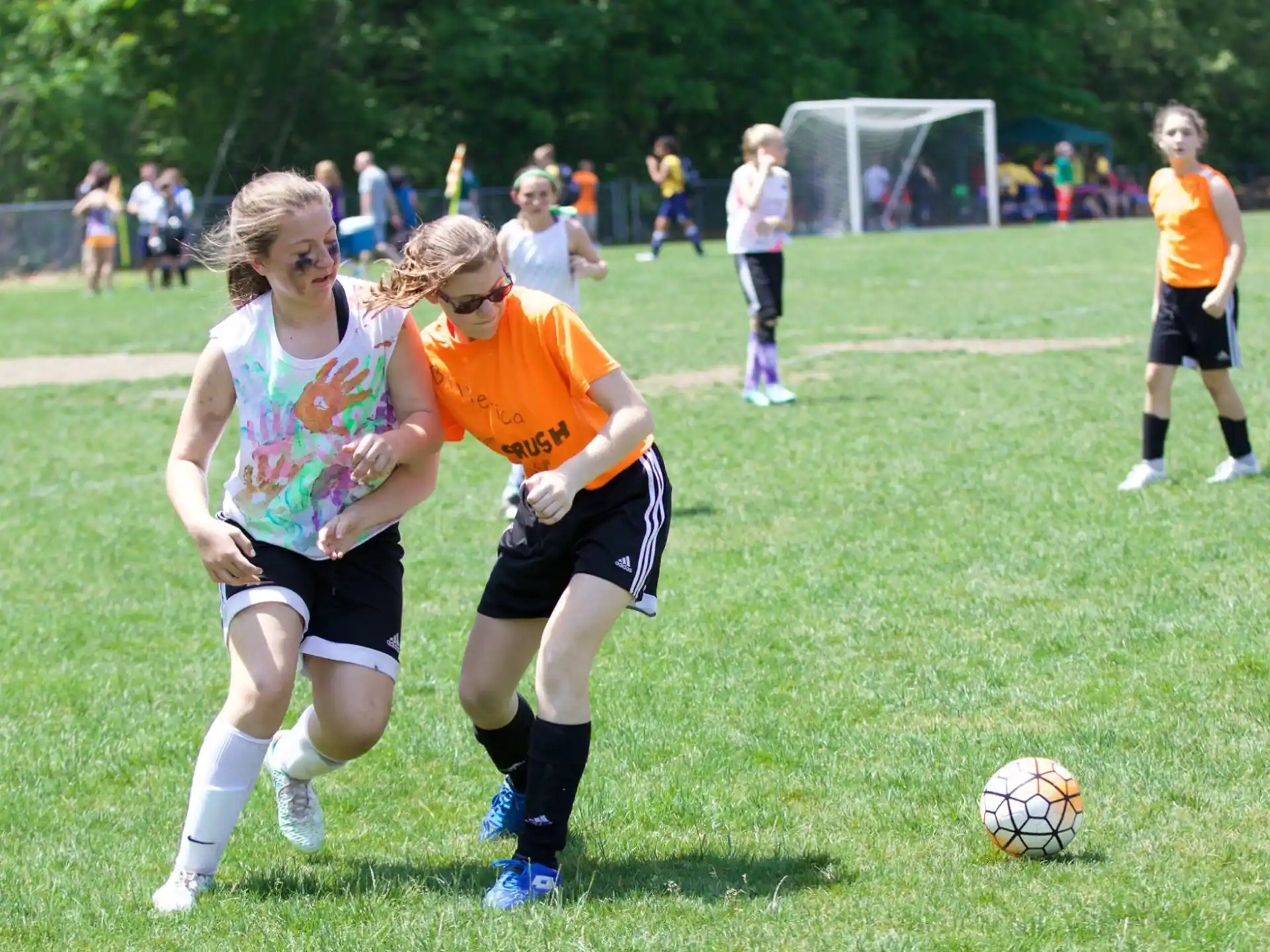 a group of people play football