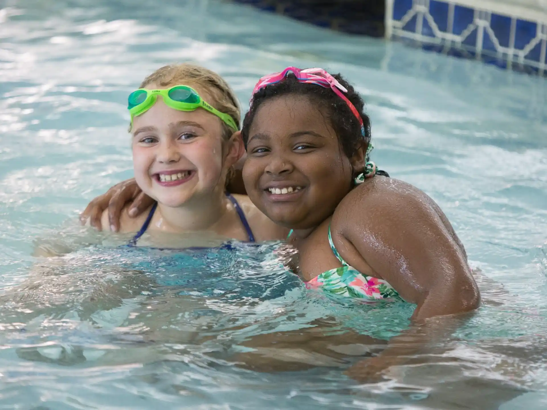 a person and a child in a pool