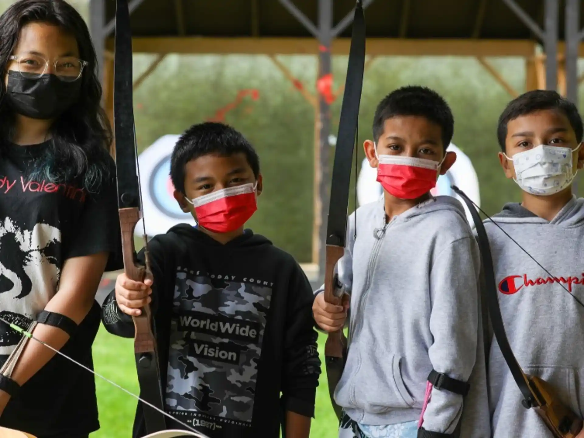 a group of kids wearing face masks