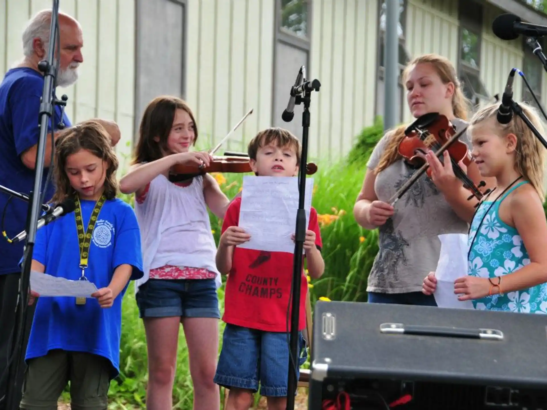 a group of kids playing instruments