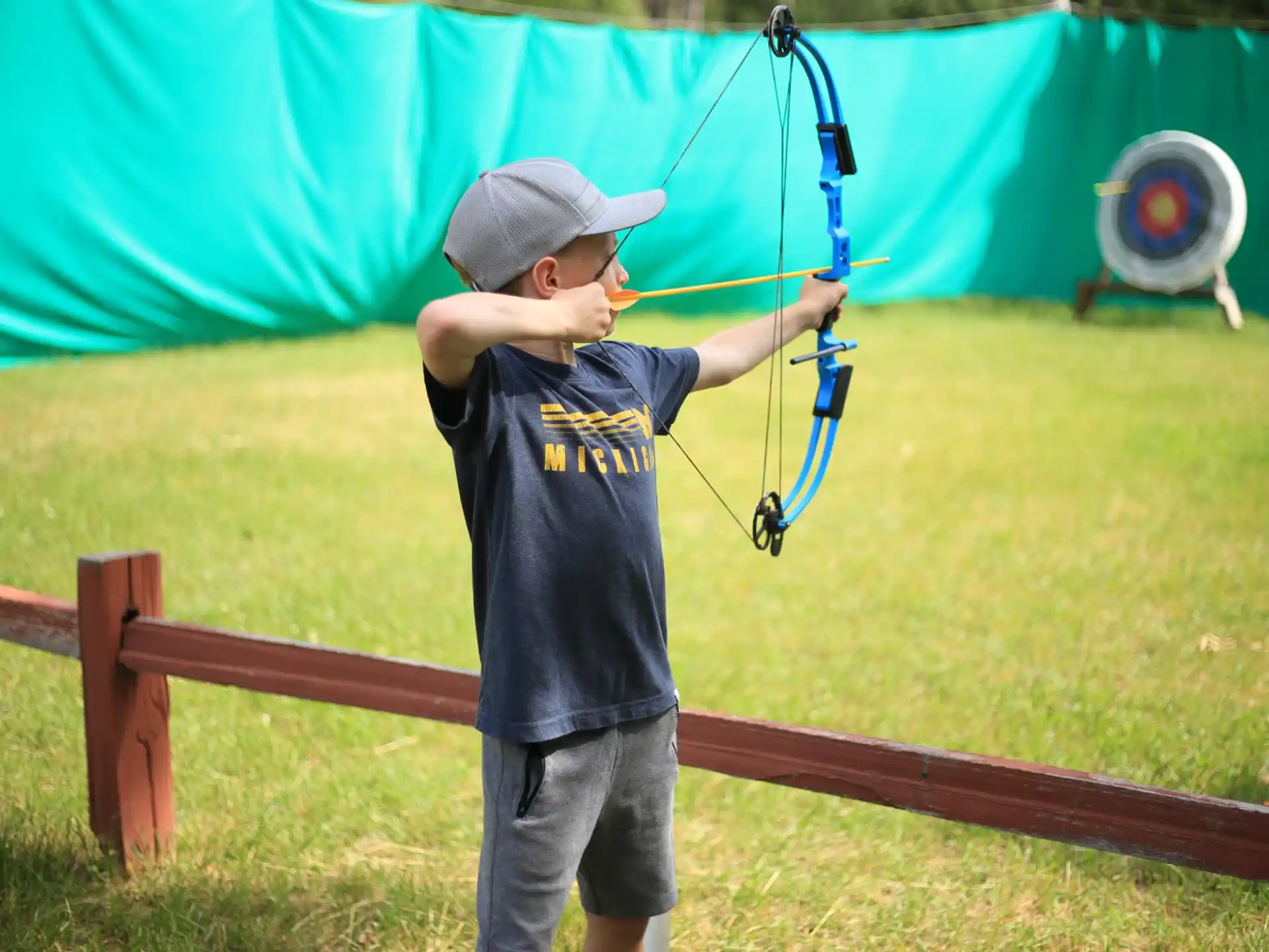 a boy holding a bow and arrow