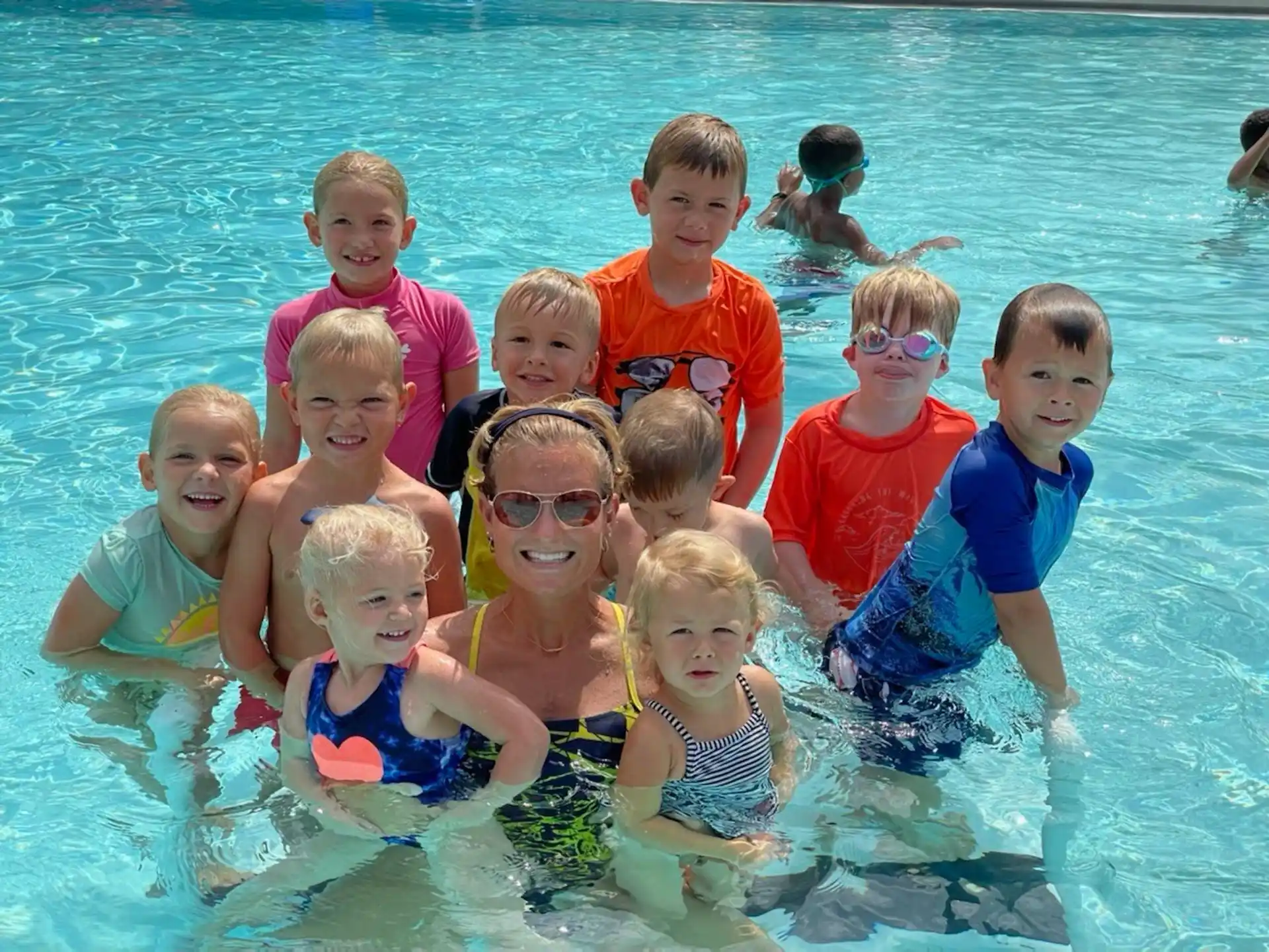 a group of children in a pool