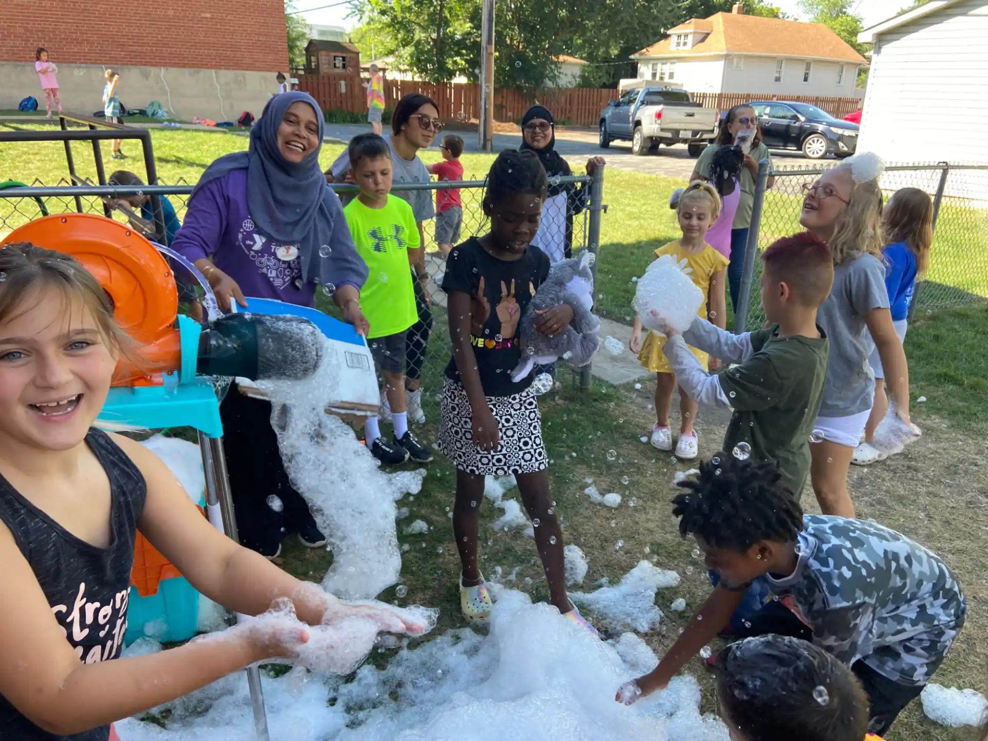 a group of children playing in the mud
